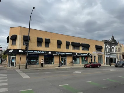 a city street lined with buildings and cars