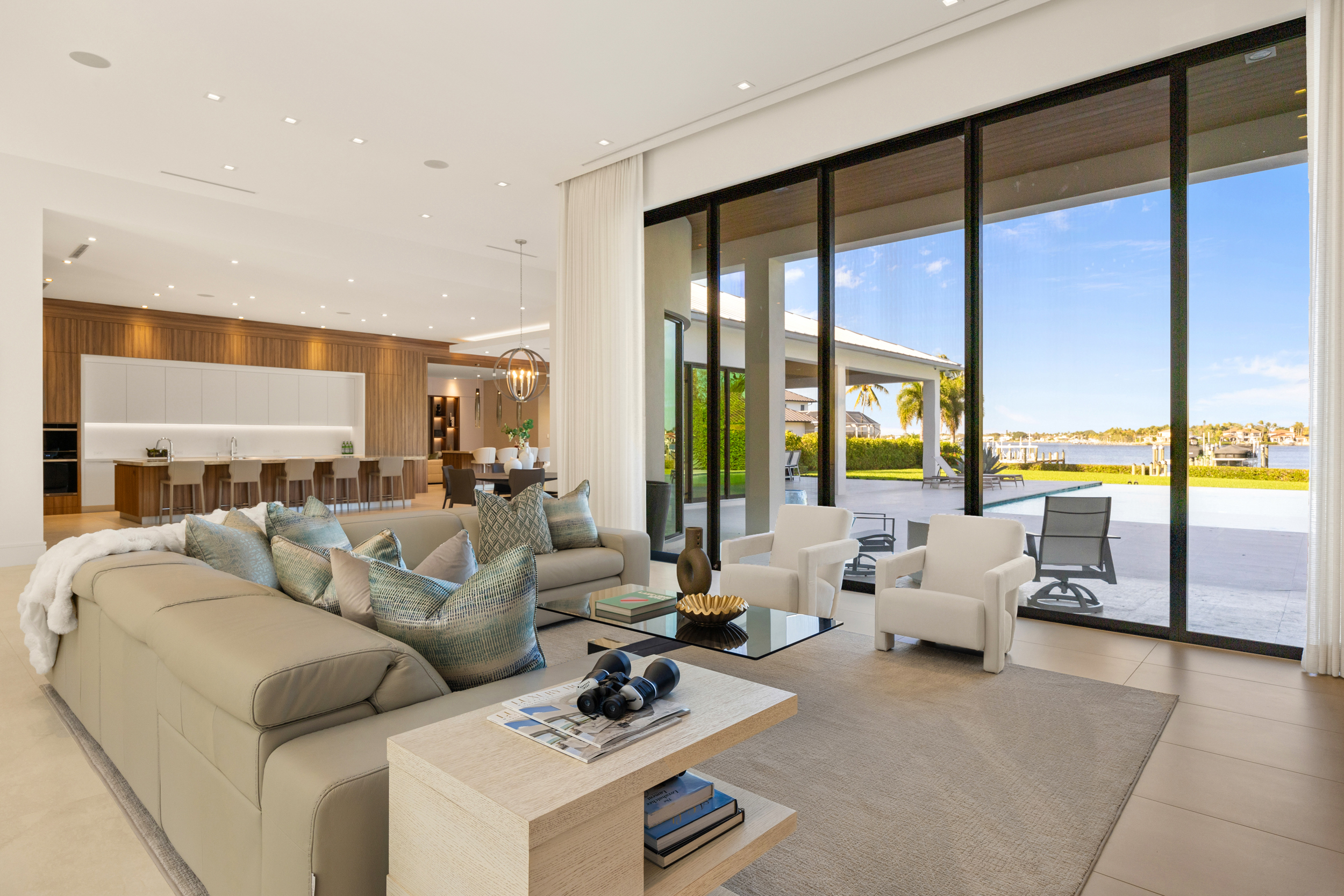 5695 Pennock Point Road Jupiter, FL 33458 - Photo 21 of 77 a living room with furniture and large windows