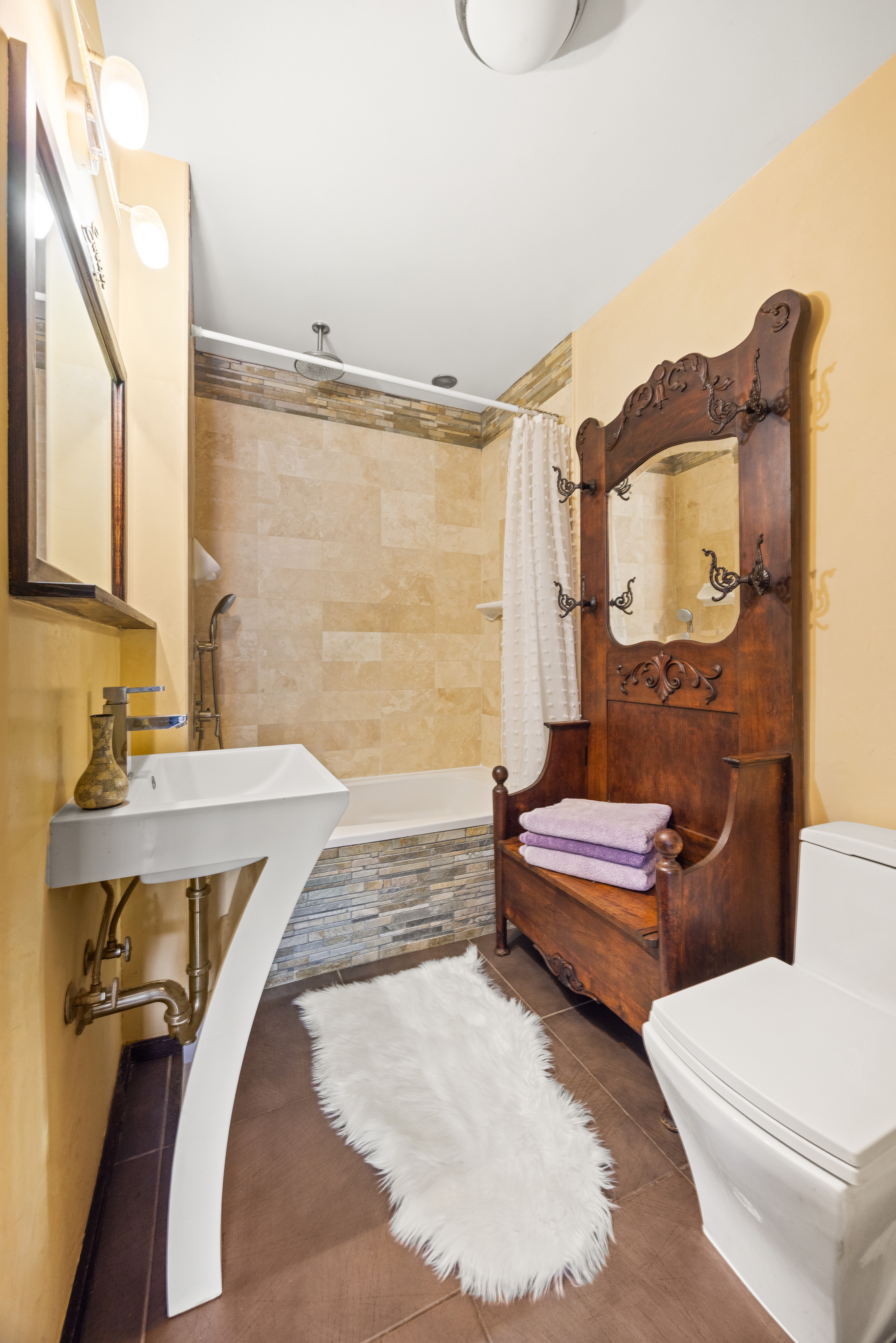 607 Manhattan Avenue, Unit 2 Brooklyn, NY 11222 - Photo 9 of 14 a bathroom with a sink a toilet and bathtub