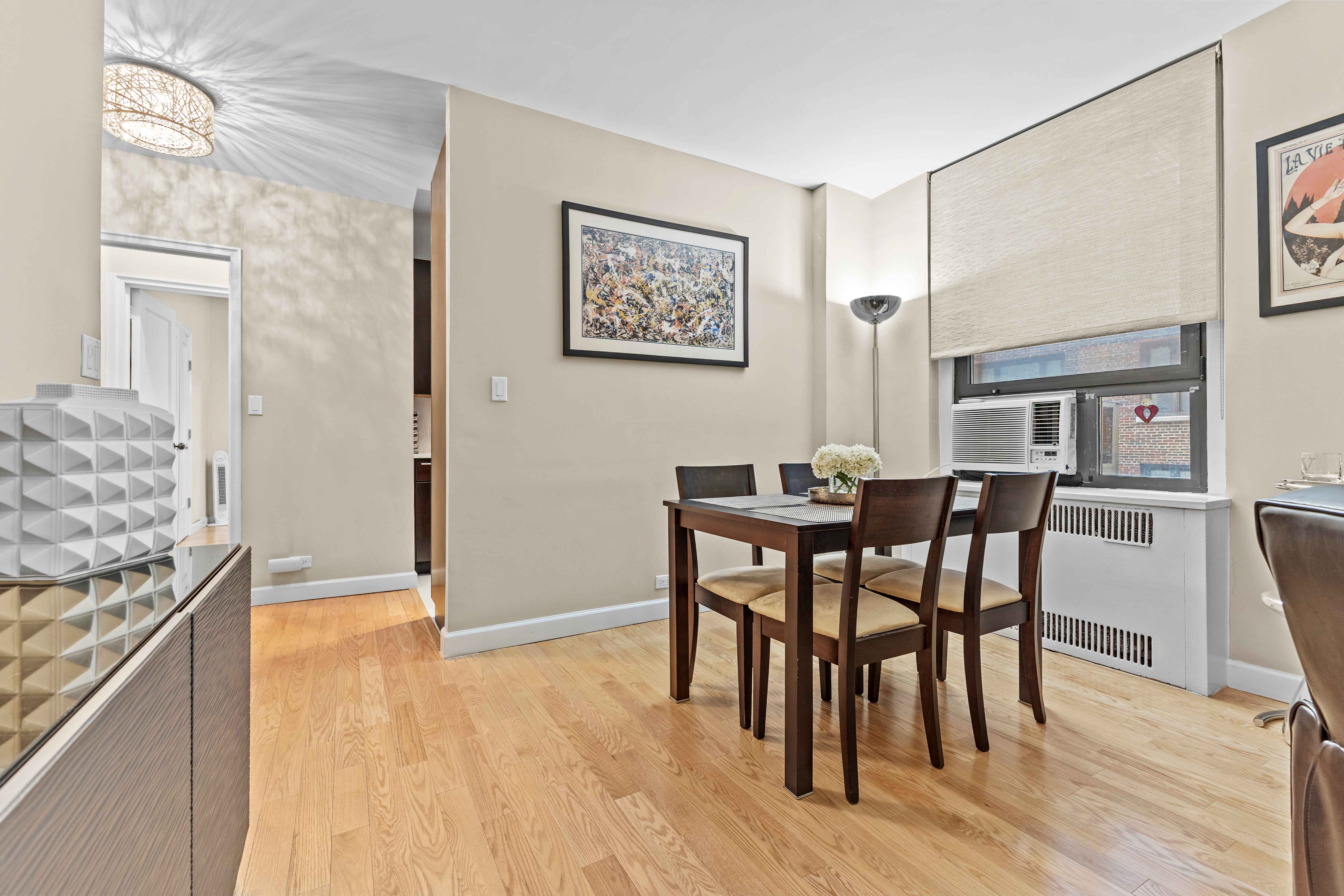 263 West End Avenue, Unit 6E Manhattan, NY 10023 - Photo 10 of 12 a view of a dining room with furniture and wooden floor