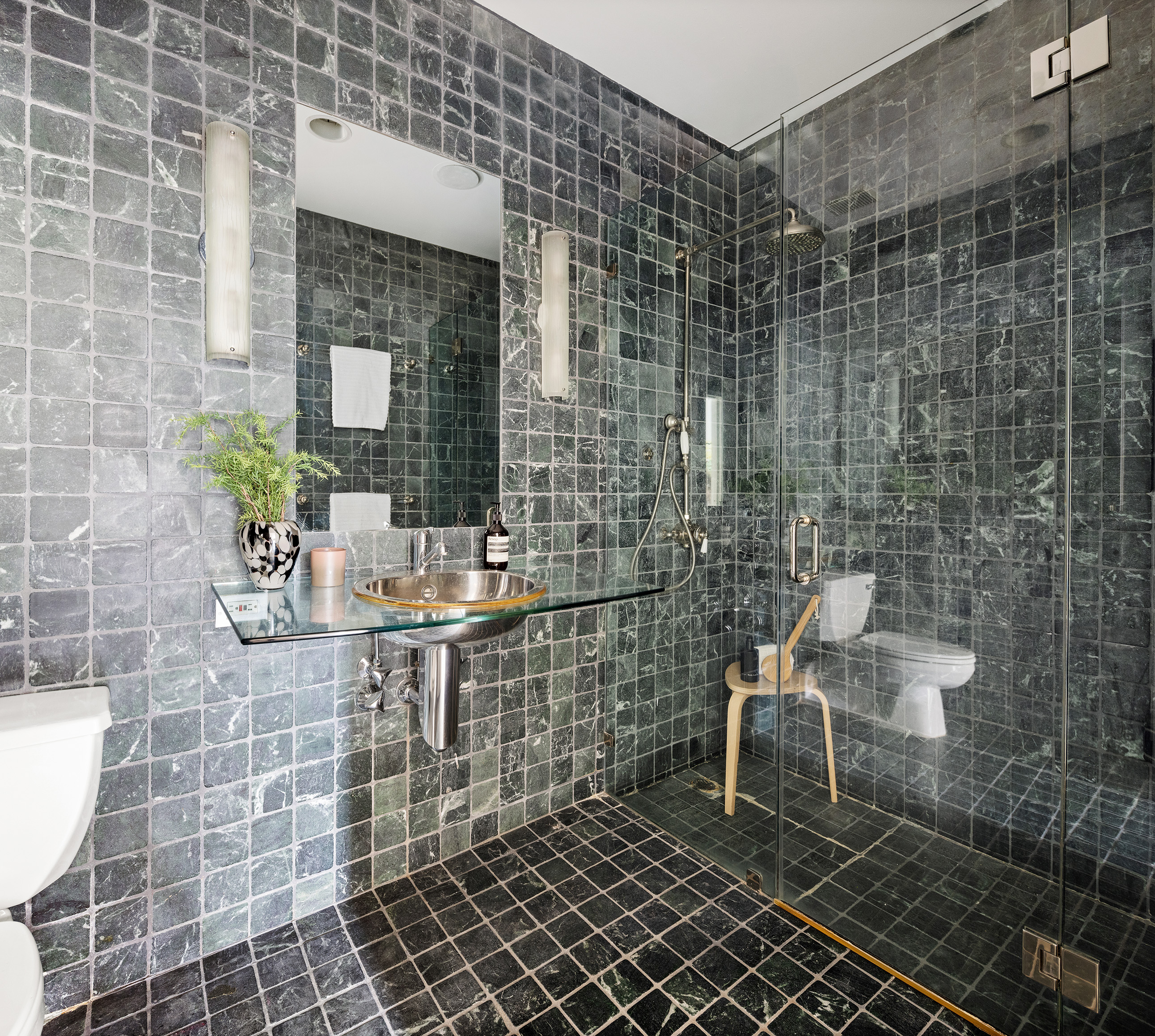 214 West 17th Street, Unit 4B Manhattan, NY 10011 - Photo 8 of 10 a view of a bathroom with a sink and a potted plant