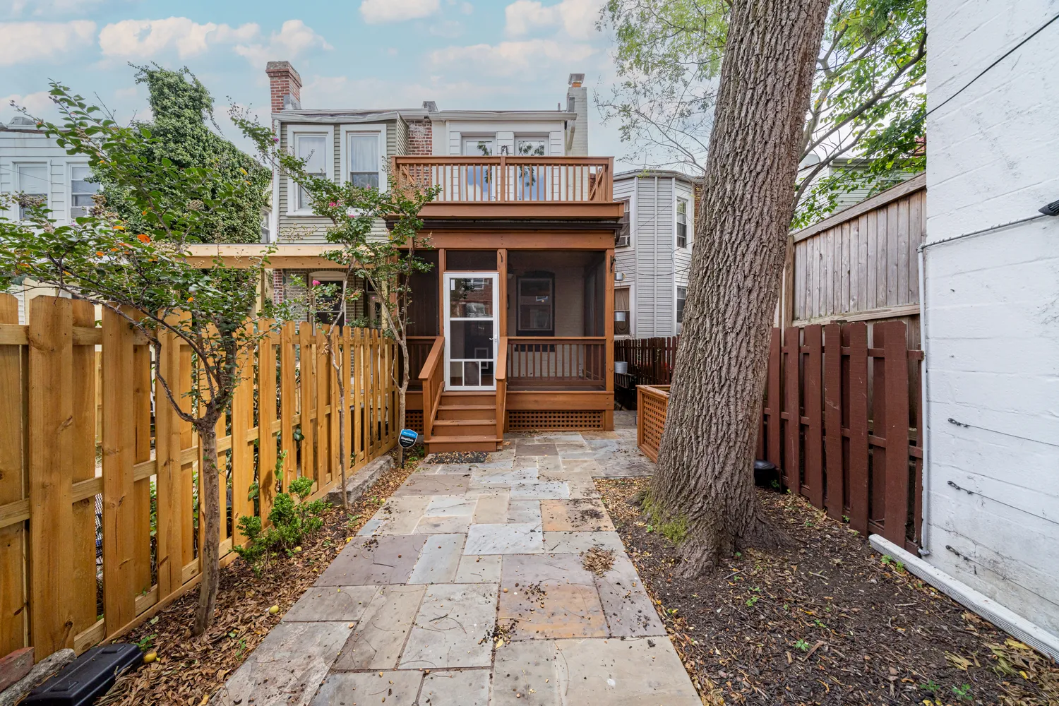 a view of a brick house with a large window