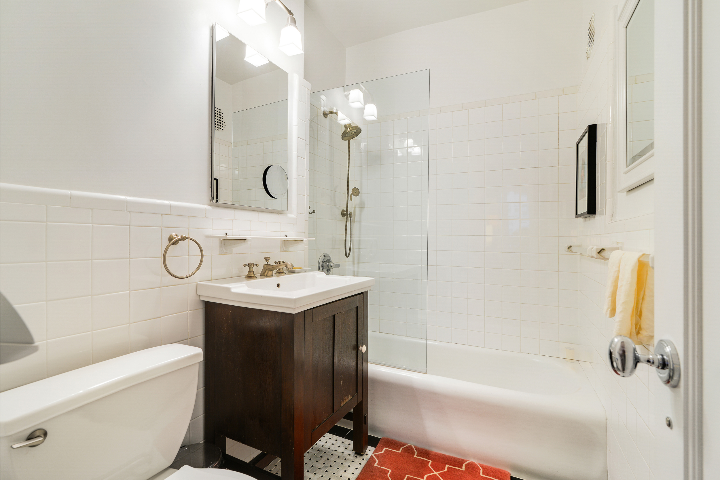 20 West 72nd Street, Unit 601 Manhattan, NY 10023 - Photo 18 of 21 a bathroom with a sink a toilet and a bathtub