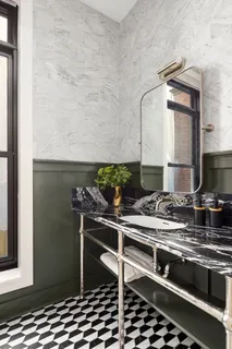 a stove top oven sitting inside of a kitchen
