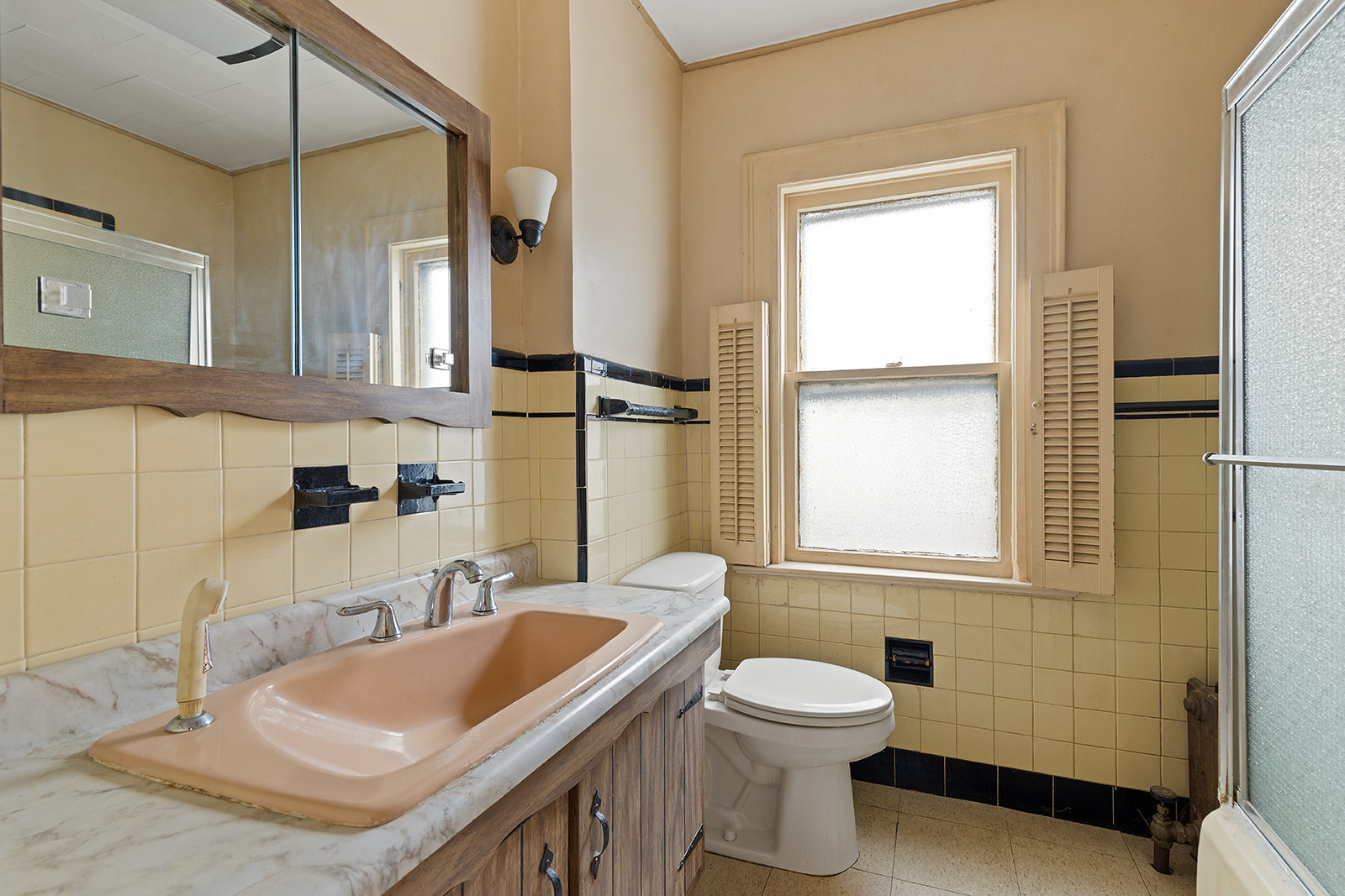 2411 Avenue M Brooklyn, NY 11210 - Photo 10 of 12 a bathroom with a sink a toilet and shower