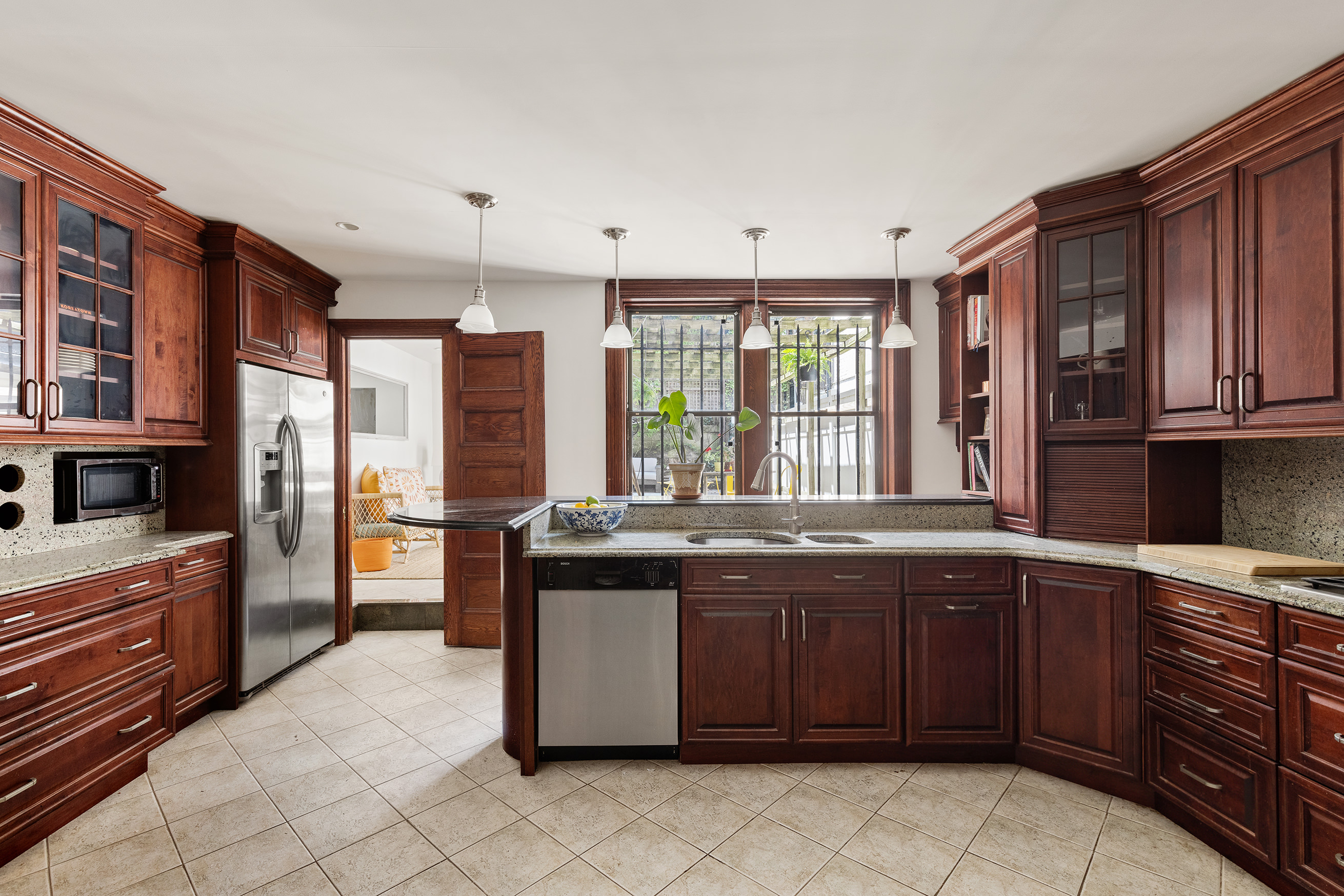 608 2nd Street Brooklyn, NY 11215 - Photo 15 of 34 a kitchen with a sink stove and cabinets