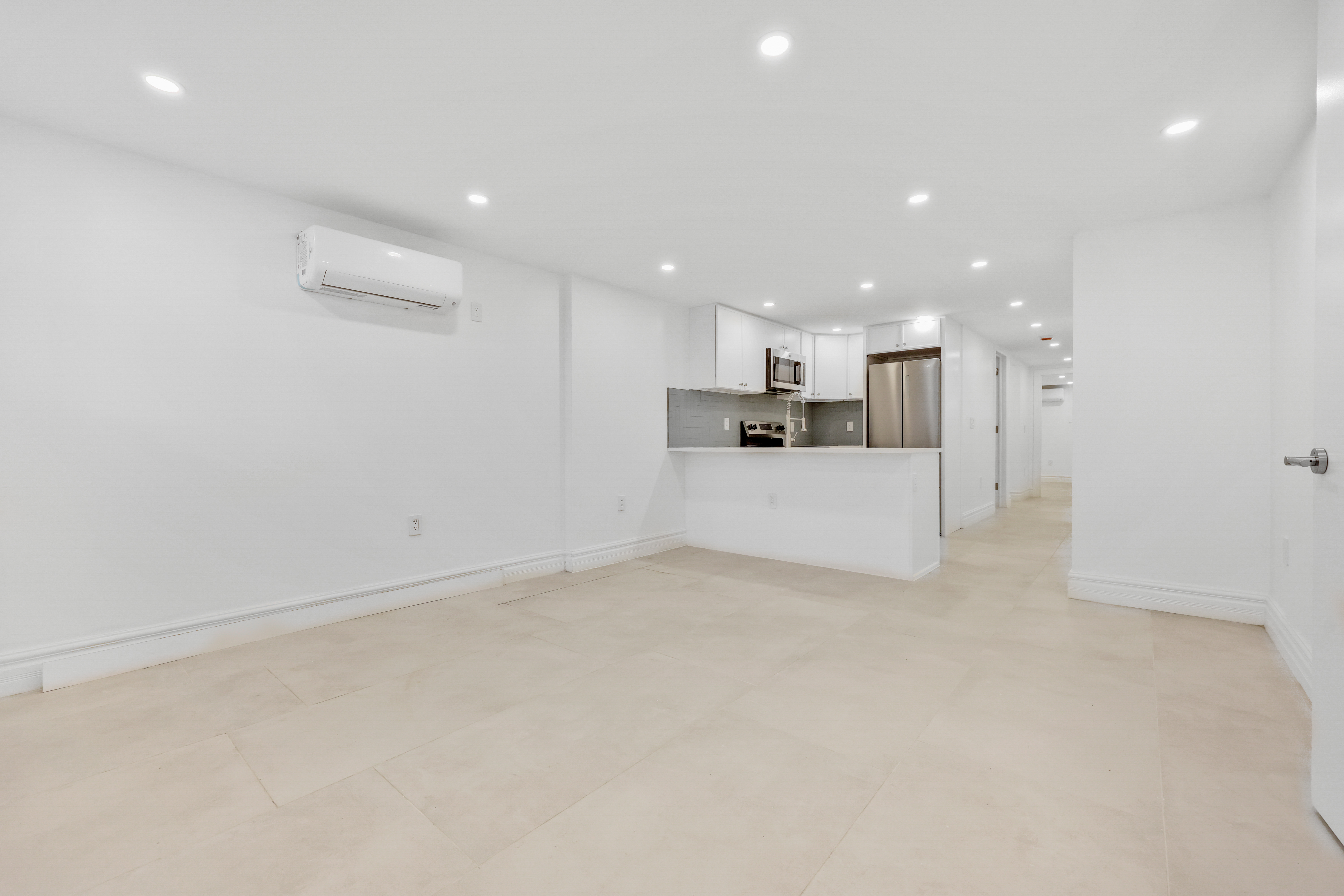 84 Pilling Street, Unit 1 Brooklyn, NY 11207 - Photo 4 of 14 a view of a kitchen with a sink and a refrigerator