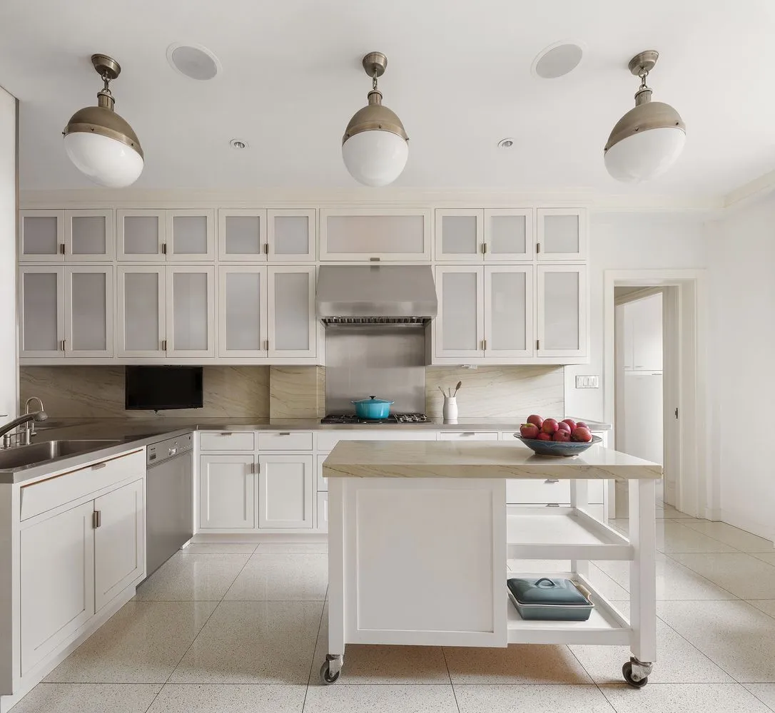a kitchen with a sink cabinets and window