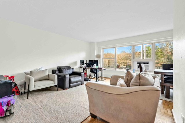135 Ashland Place, Unit 5A Brooklyn, NY 11201 - Photo 2 of 12 a living room with furniture and a large window