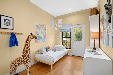 a bedroom with furniture and a window