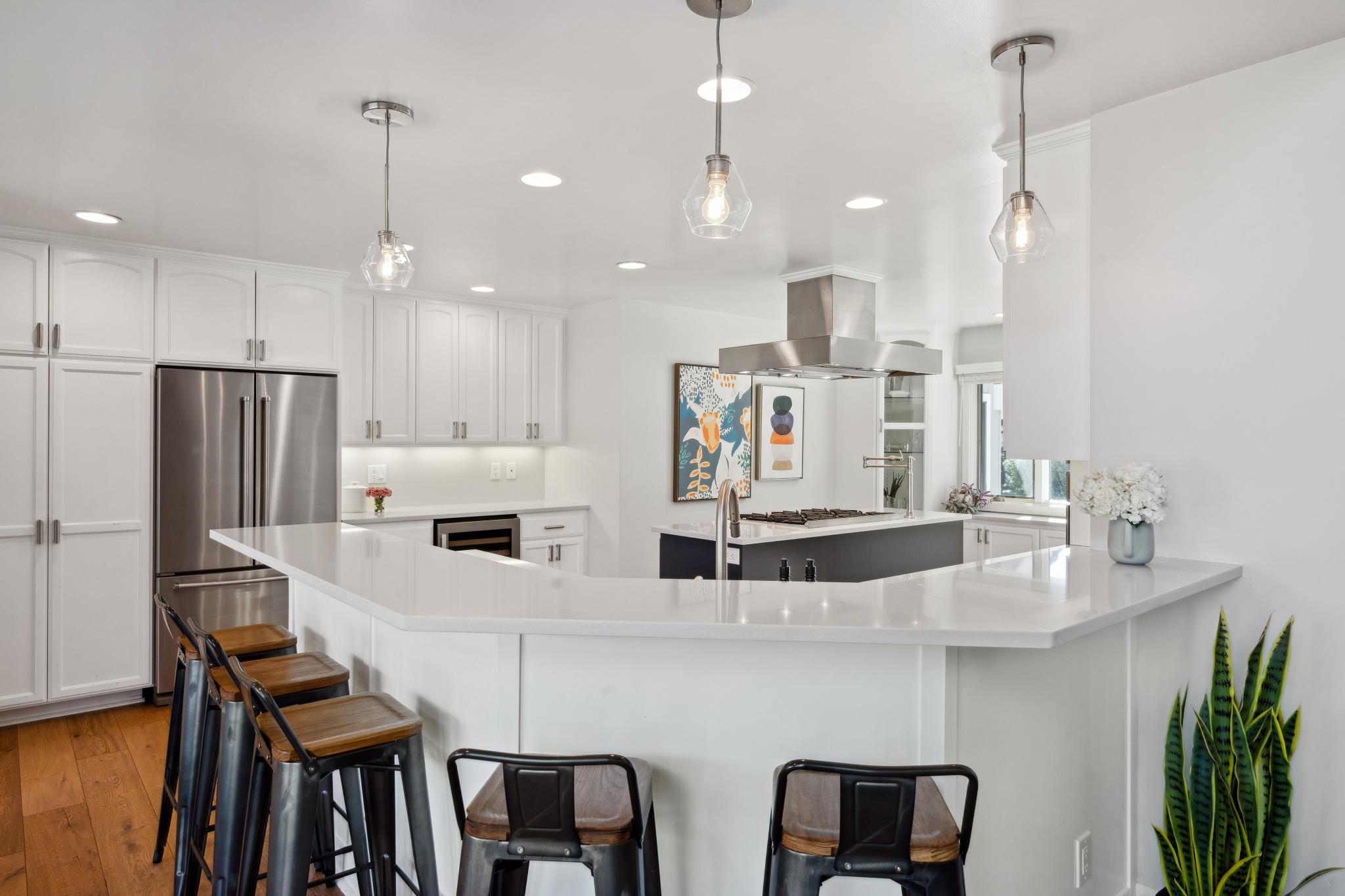 123 Frey Road Santa Rosa, CA 95409 - Photo 20 of 62 a kitchen with stainless steel appliances kitchen island granite countertop a table chairs and a refrigerator