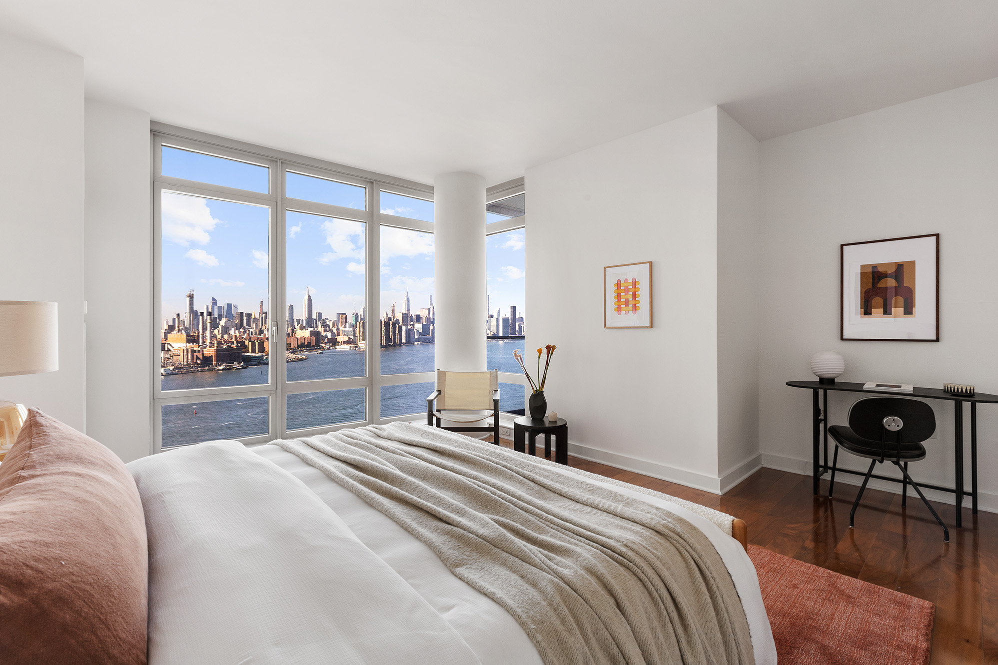 2 Northside Piers, Unit 25P Brooklyn, NY 11249 - Photo 9 of 26 a bedroom with a bed and a large window