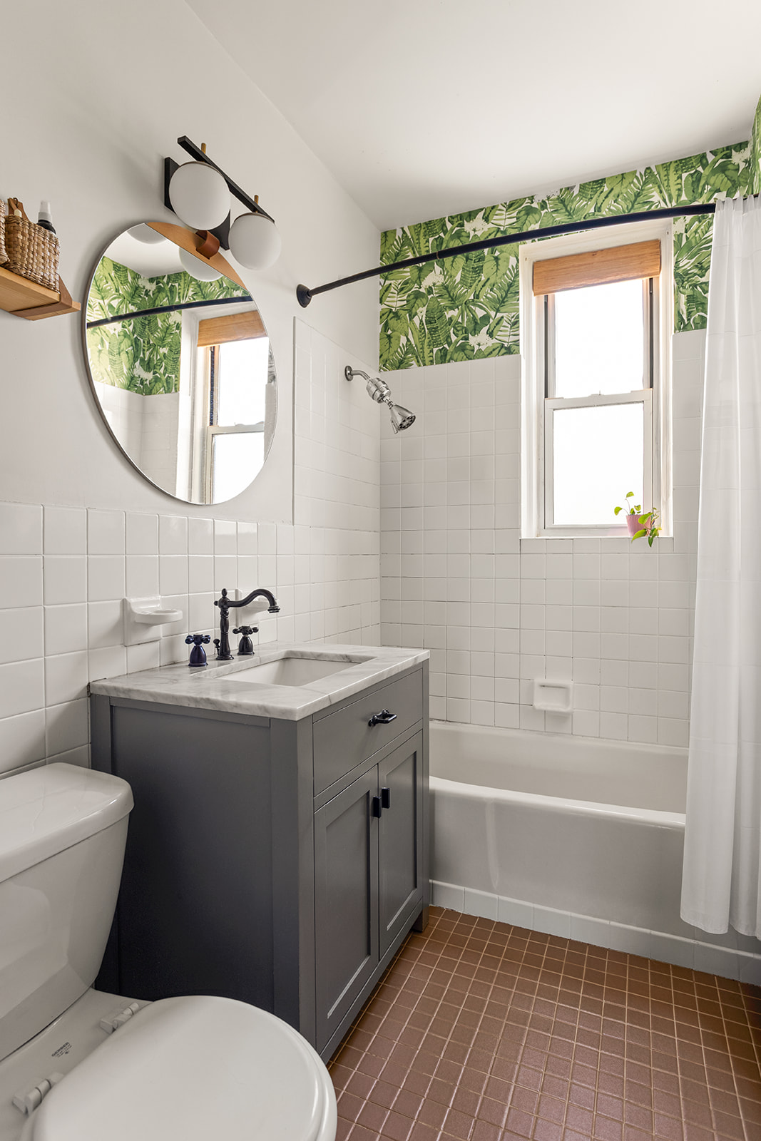 35-21 80th Street, Unit 52A Queens, NY 11372 - Photo 7 of 11 a bathroom with a sink a toilet and a mirror