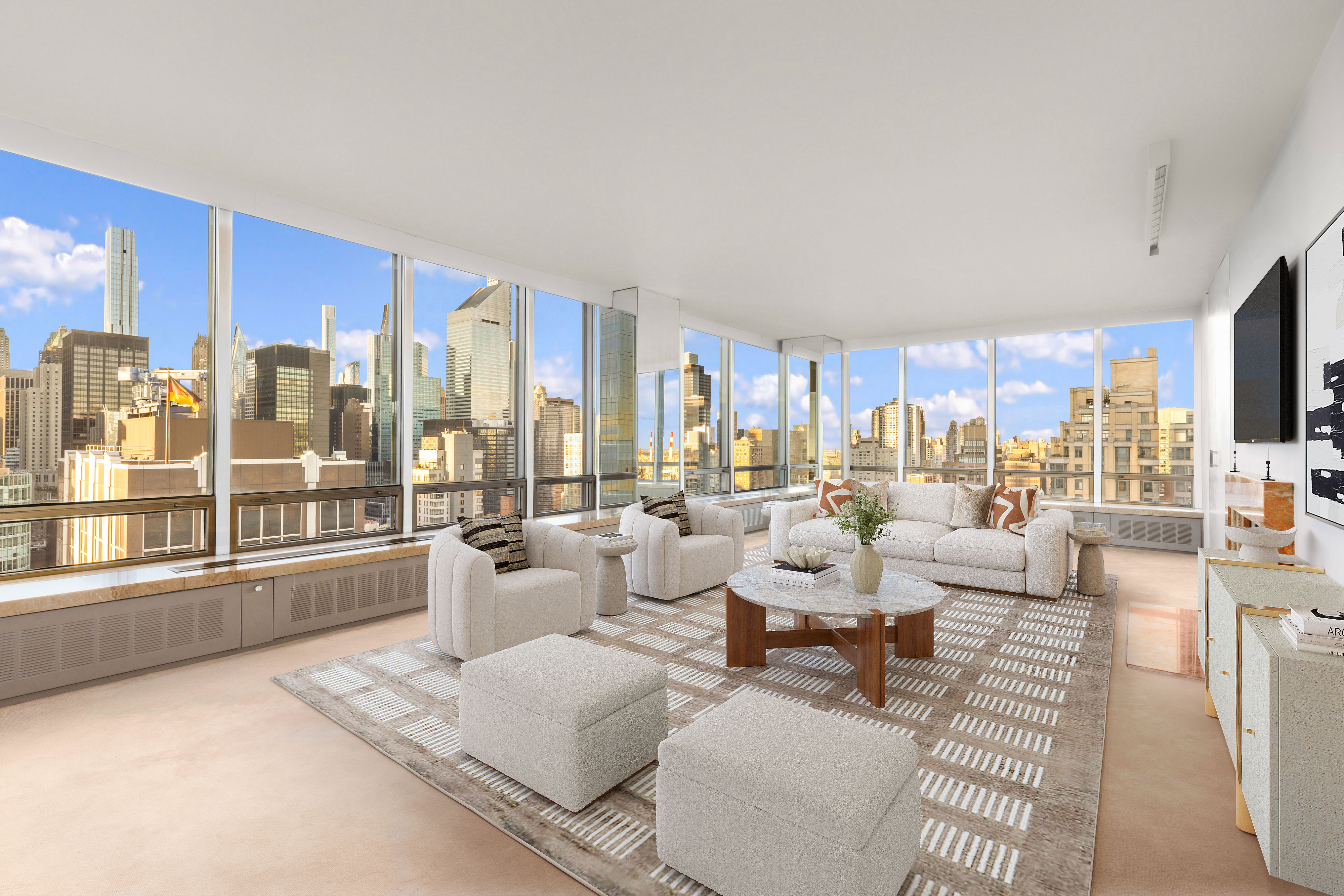 a large living room with furniture large windows and a view of living room