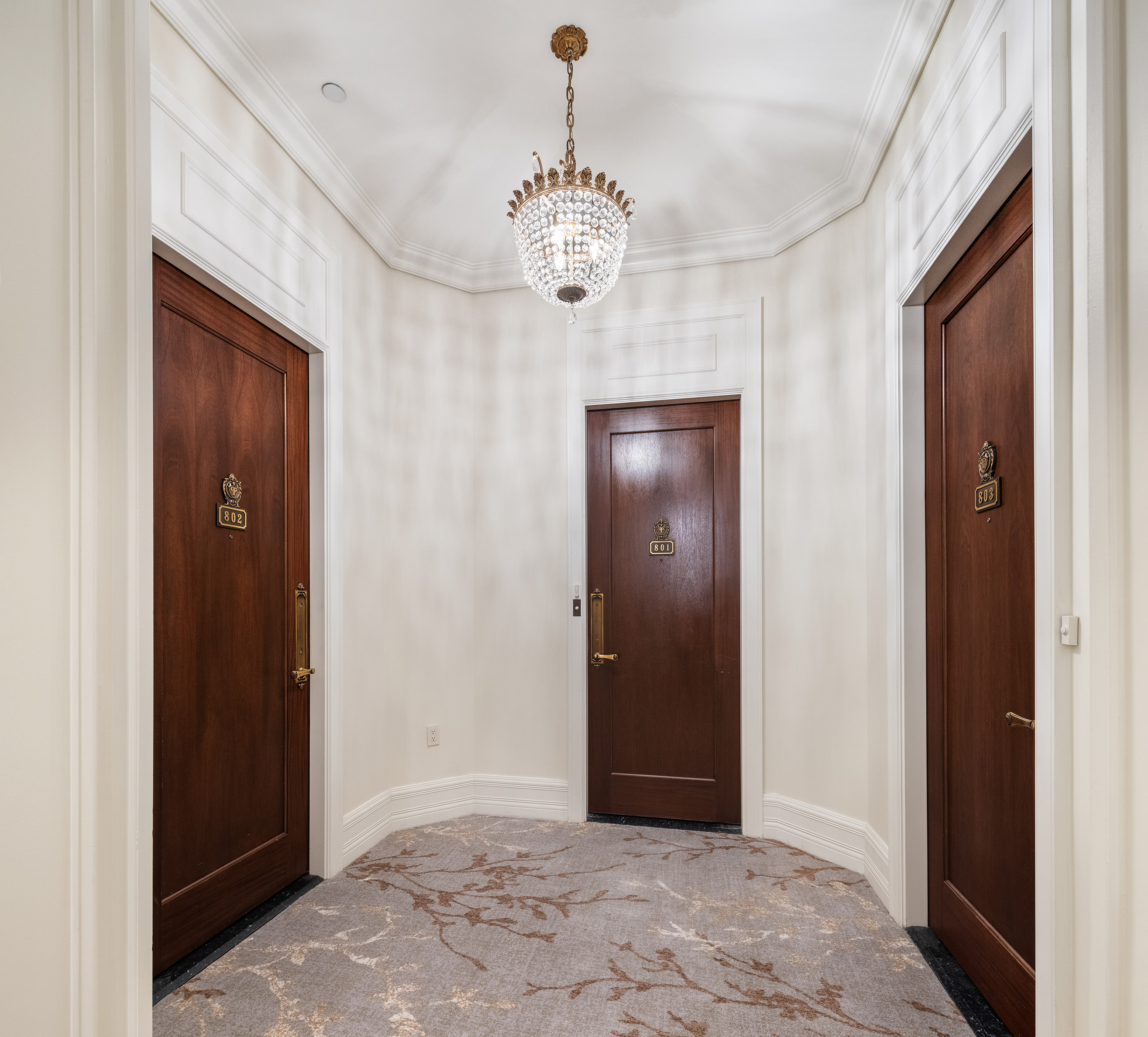 1 Central Park South, Unit 8010203 Manhattan, NY 10019 - Photo 3 of 45 a view of an entryway with chandelier