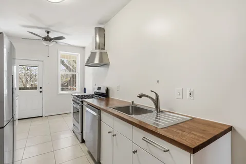 a kitchen with a sink and cabinets