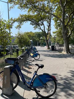 a view of a swimming pool with sitting area and furniture