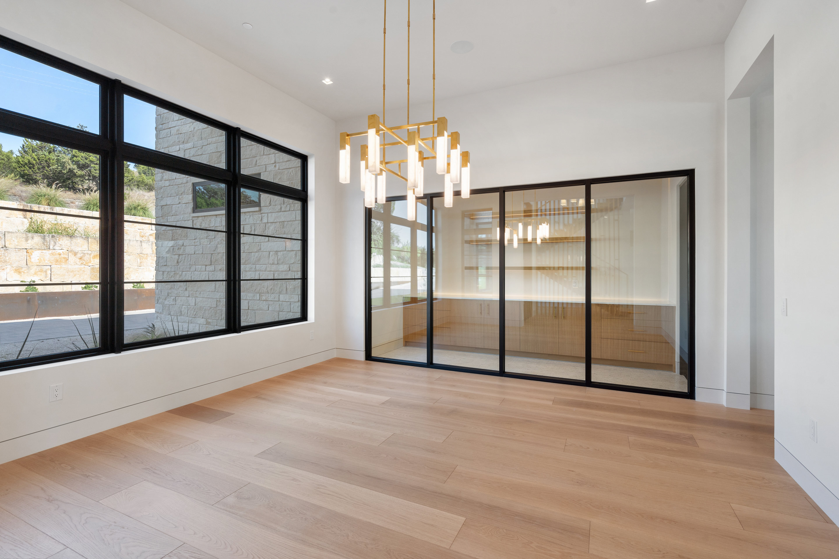 1905 Hallam Drive Austin, TX 78746 - Photo 6 of 39 a view of an empty room with a window