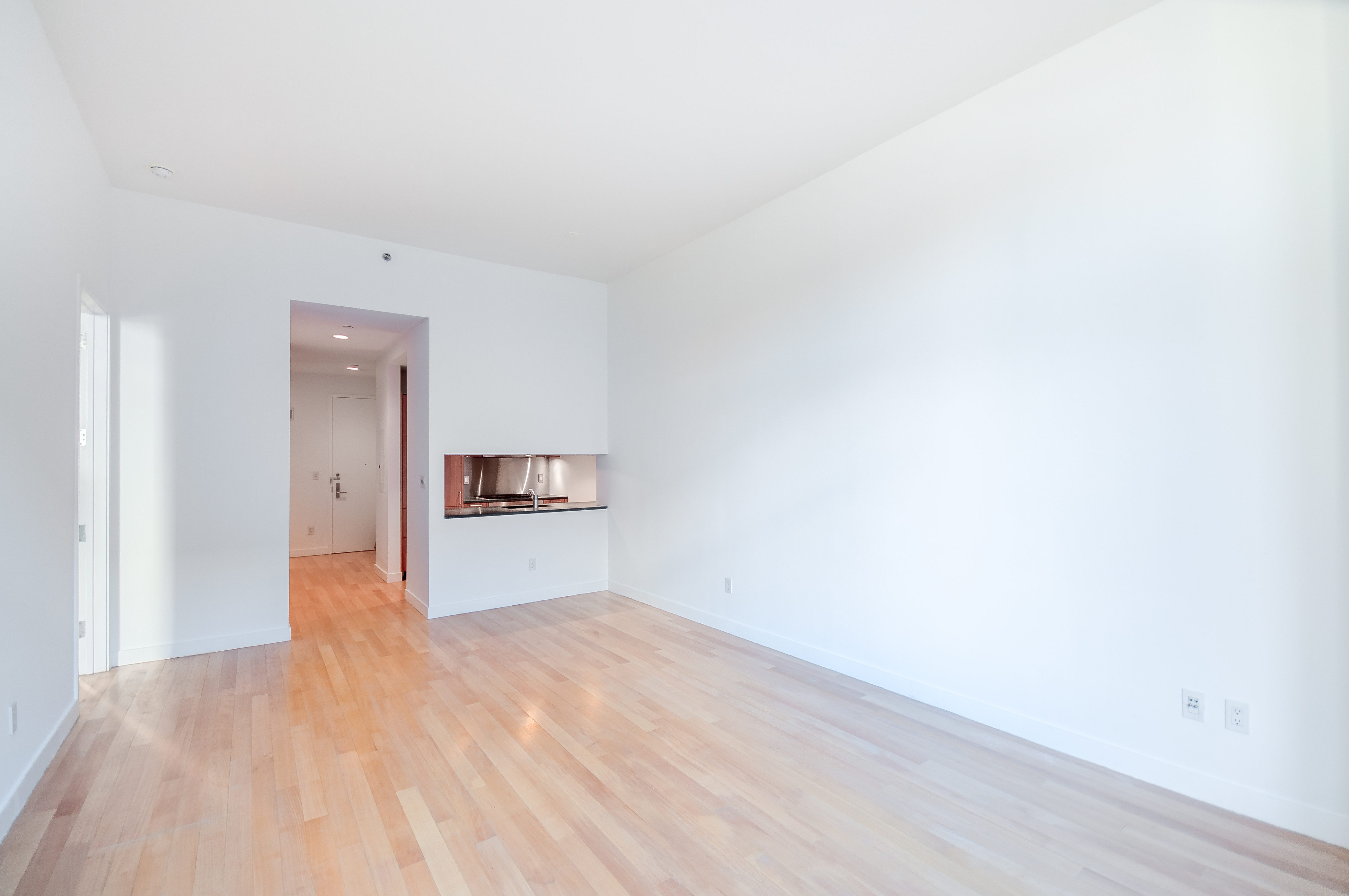 450 East 83rd Street, Unit 3D Manhattan, NY 10028 - Photo 6 of 15 a view of empty room with wooden floor