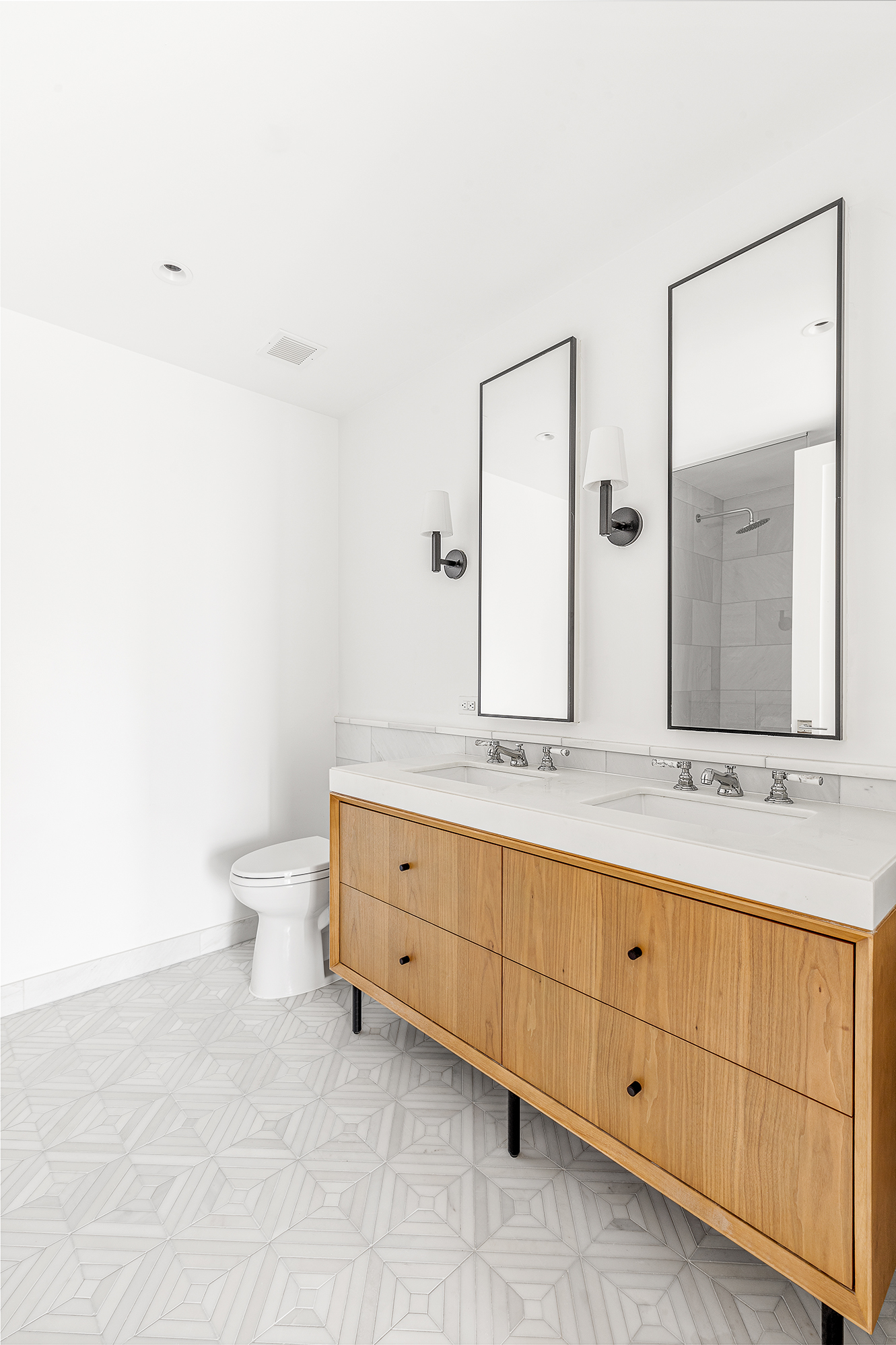 300 West 122nd Street, Unit 12C Manhattan, NY 10027 - Photo 9 of 11 a bathroom with a granite countertop sink mirror and toilet
