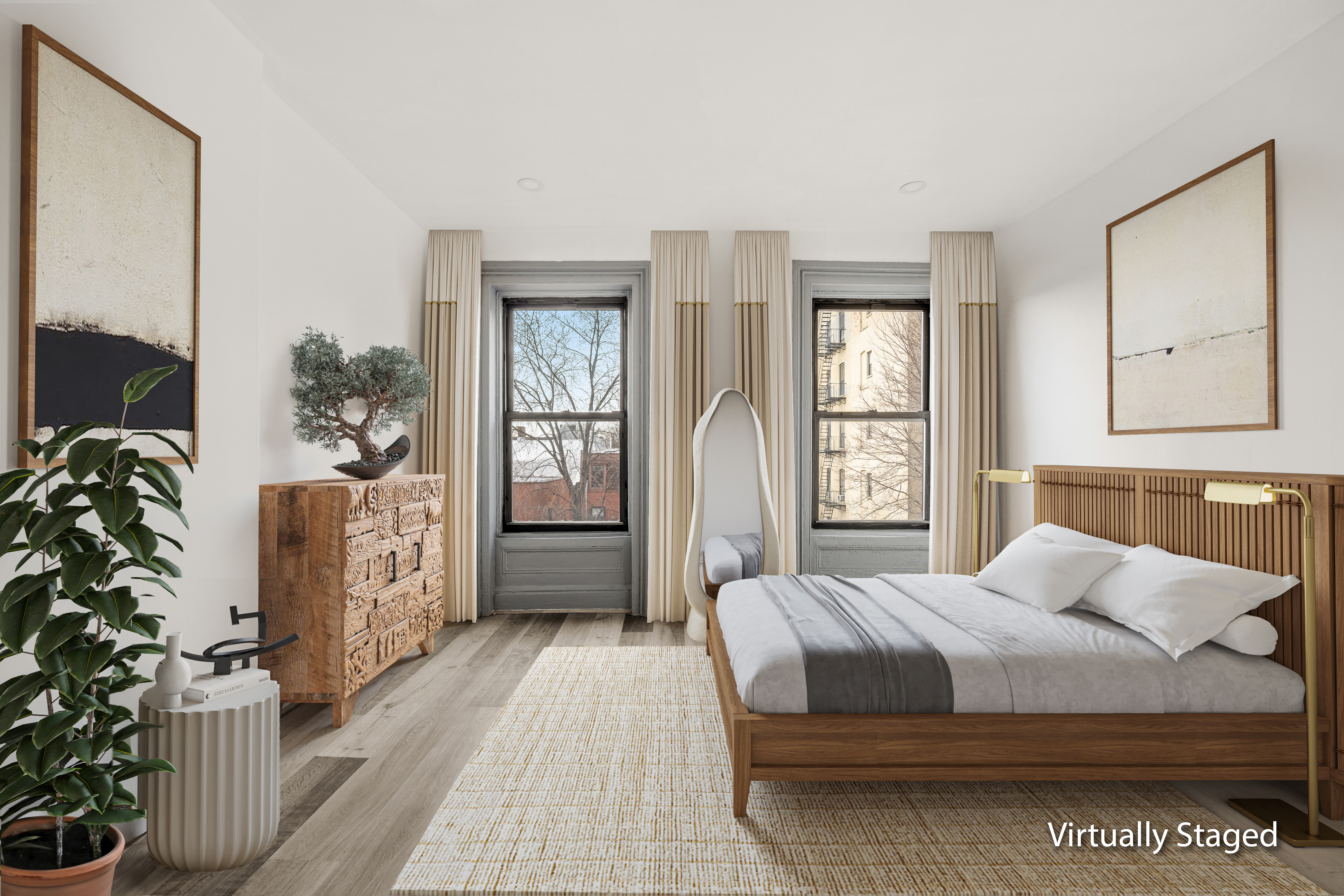 126 Quincy Street, Unit 3 Brooklyn, NY 11216 - Photo 3 of 11 a bedroom with a large bed and a potted plant