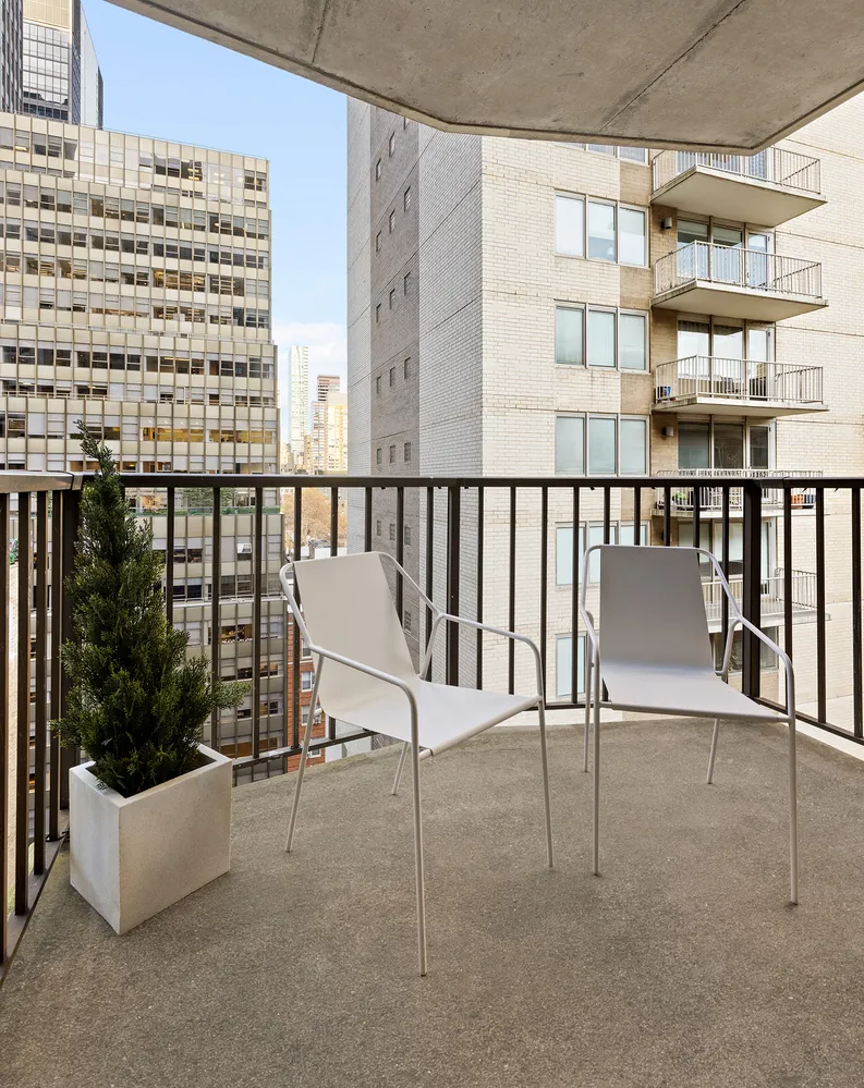 a view of balcony with furniture