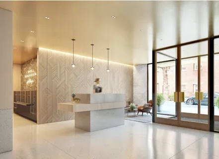 a living room with large windows and a table