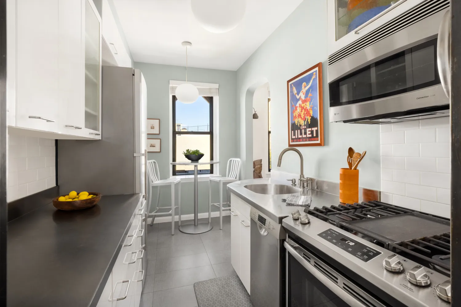 a kitchen with stainless steel appliances granite countertop a stove and a sink