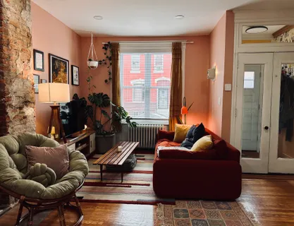 a living room with furniture and a window