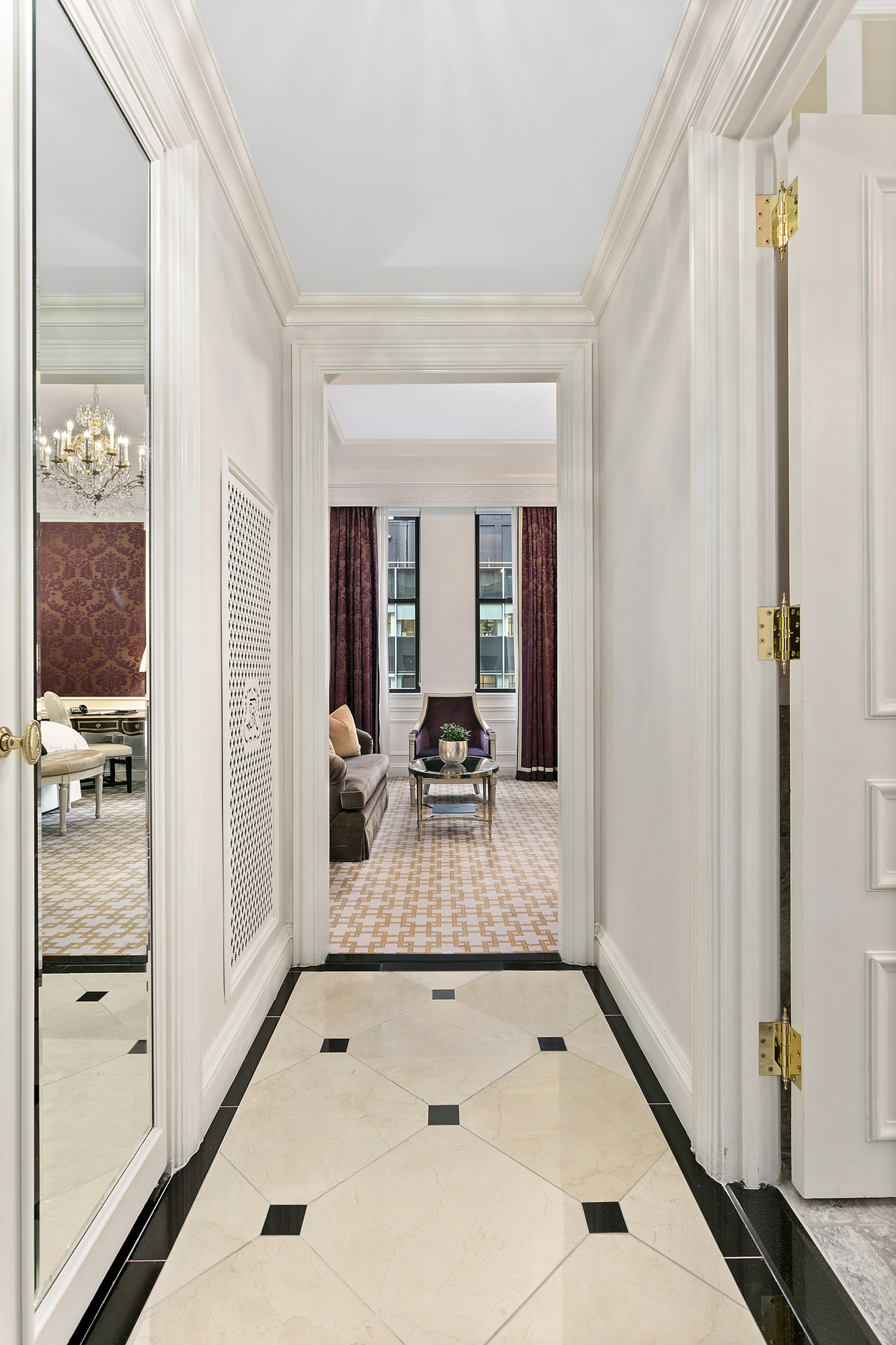 2 East 55th Street, Unit 921W47 Manhattan, NY 10022 - Photo 6 of 12 a very nice looking room with a large window and chandelier