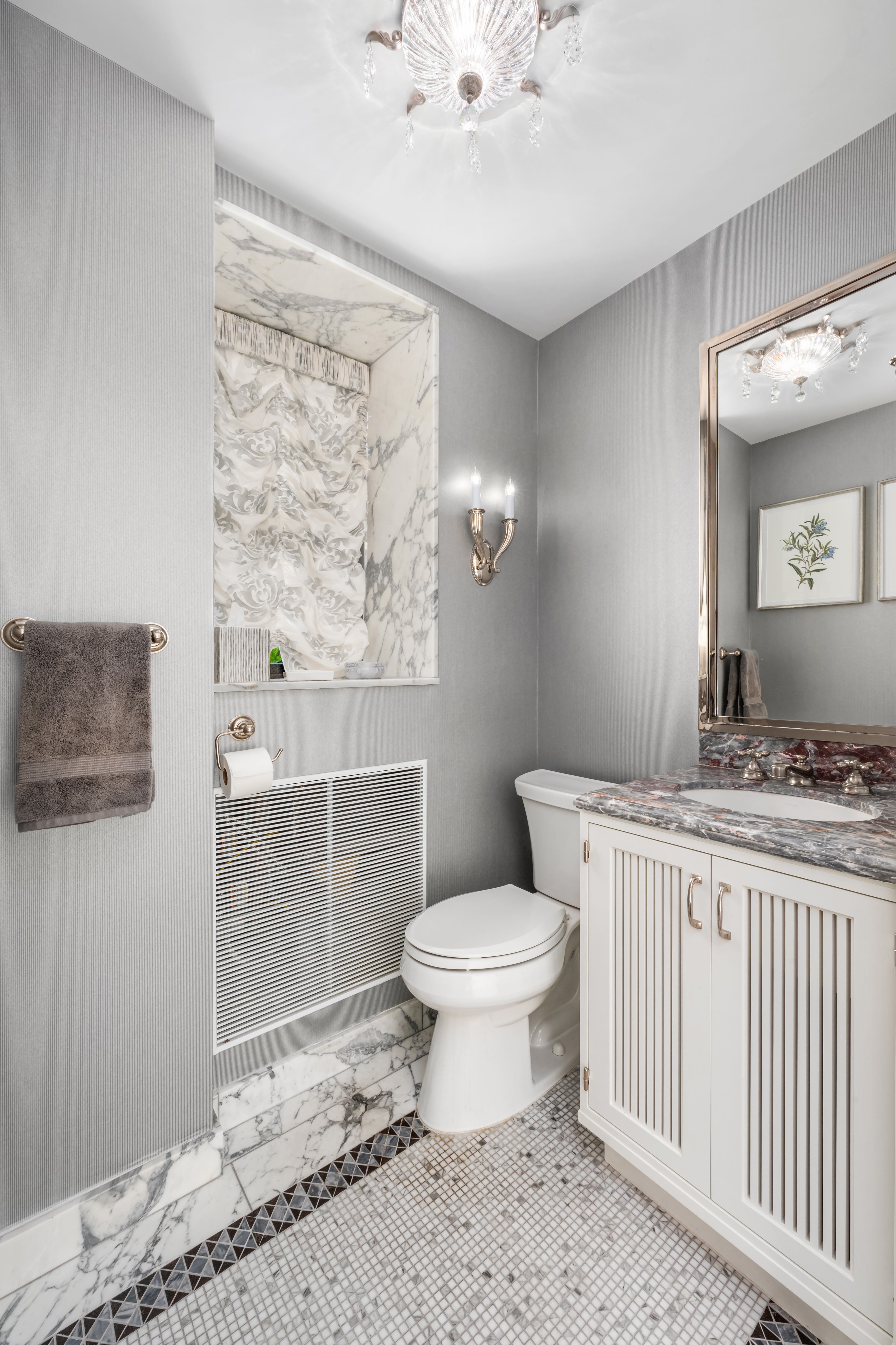 150 West 12th Street, Unit 3WEST Manhattan, NY 10011 - Photo 35 of 39 a bathroom with a toilet sink and mirror