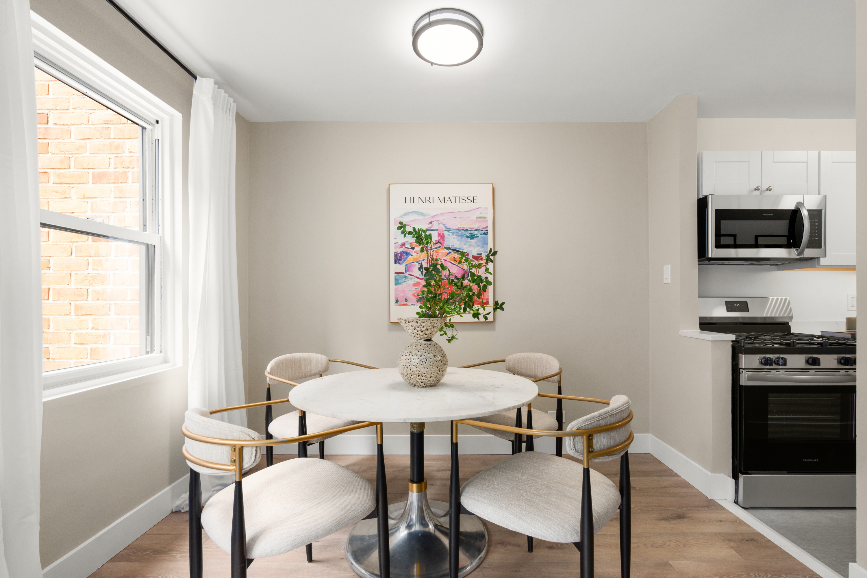347 East 53rd Street, Unit 2C Manhattan, NY 10022 - Photo 10 of 18 a dining room with furniture and window