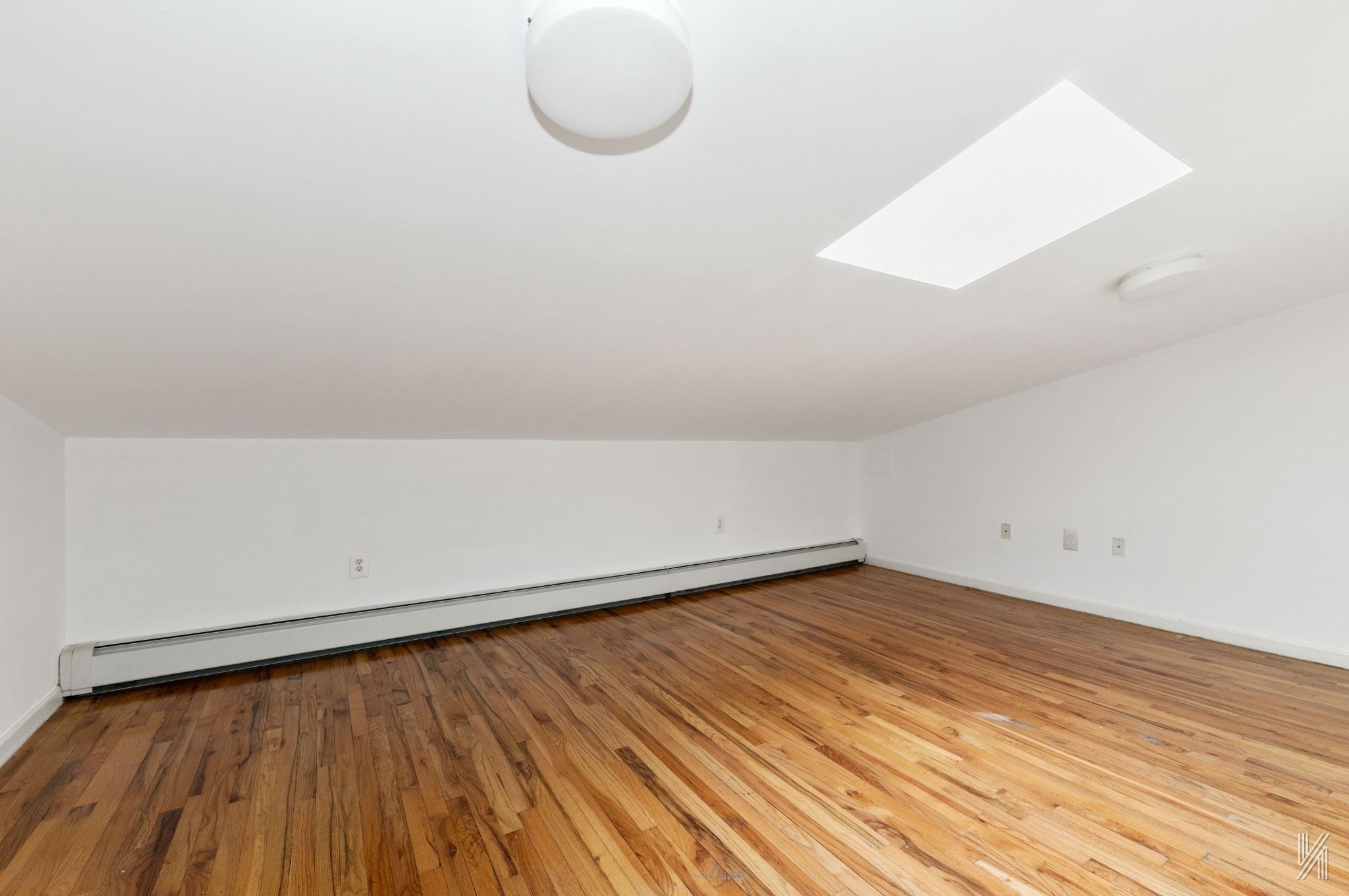 426 54th Street Brooklyn, NY 11220 - Photo 4 of 22 a view of a room with wooden floor