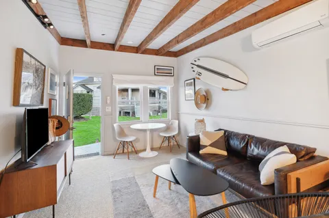 a bedroom with a bed and a mirror