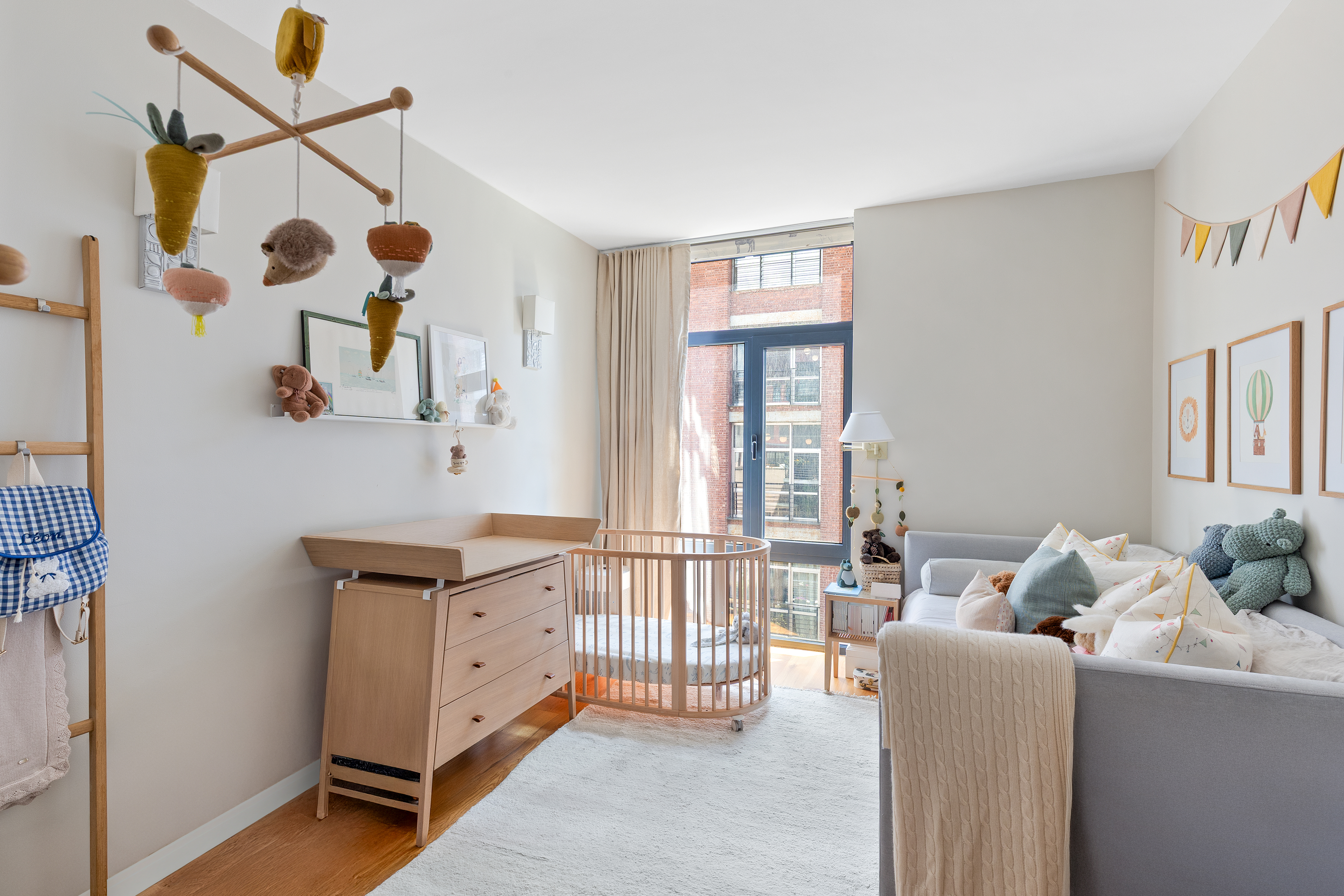 47 Bridge Street, Unit 5D Brooklyn, NY 11201 - Photo 9 of 21 a living room with furniture and a window
