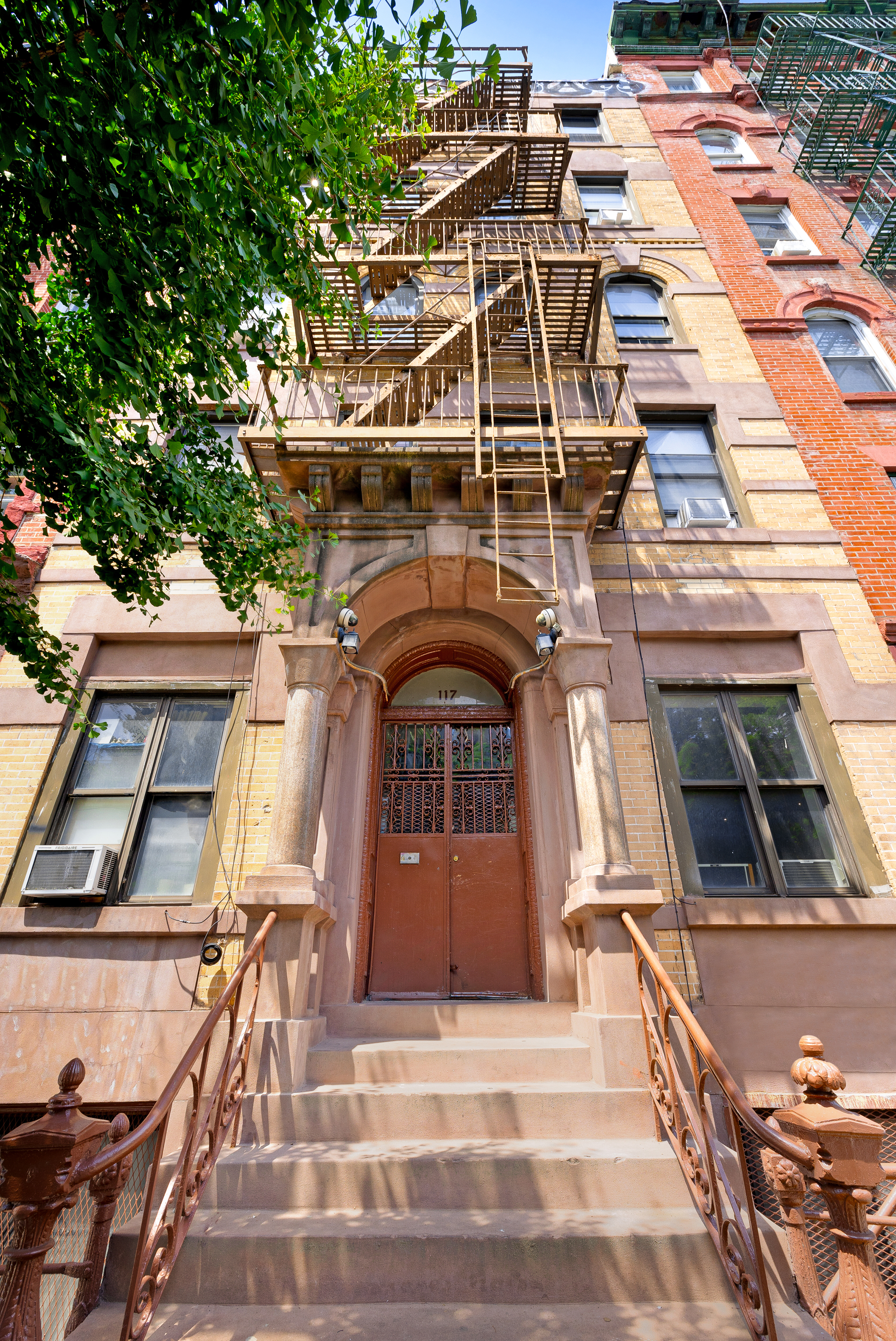117 Henry Street, Unit 12A Manhattan, NY 10002 - Photo 5 of 5 a view of a tall building with a door