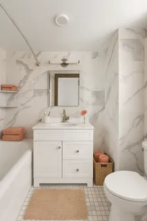 a bathroom with a sink a toilet and mirror