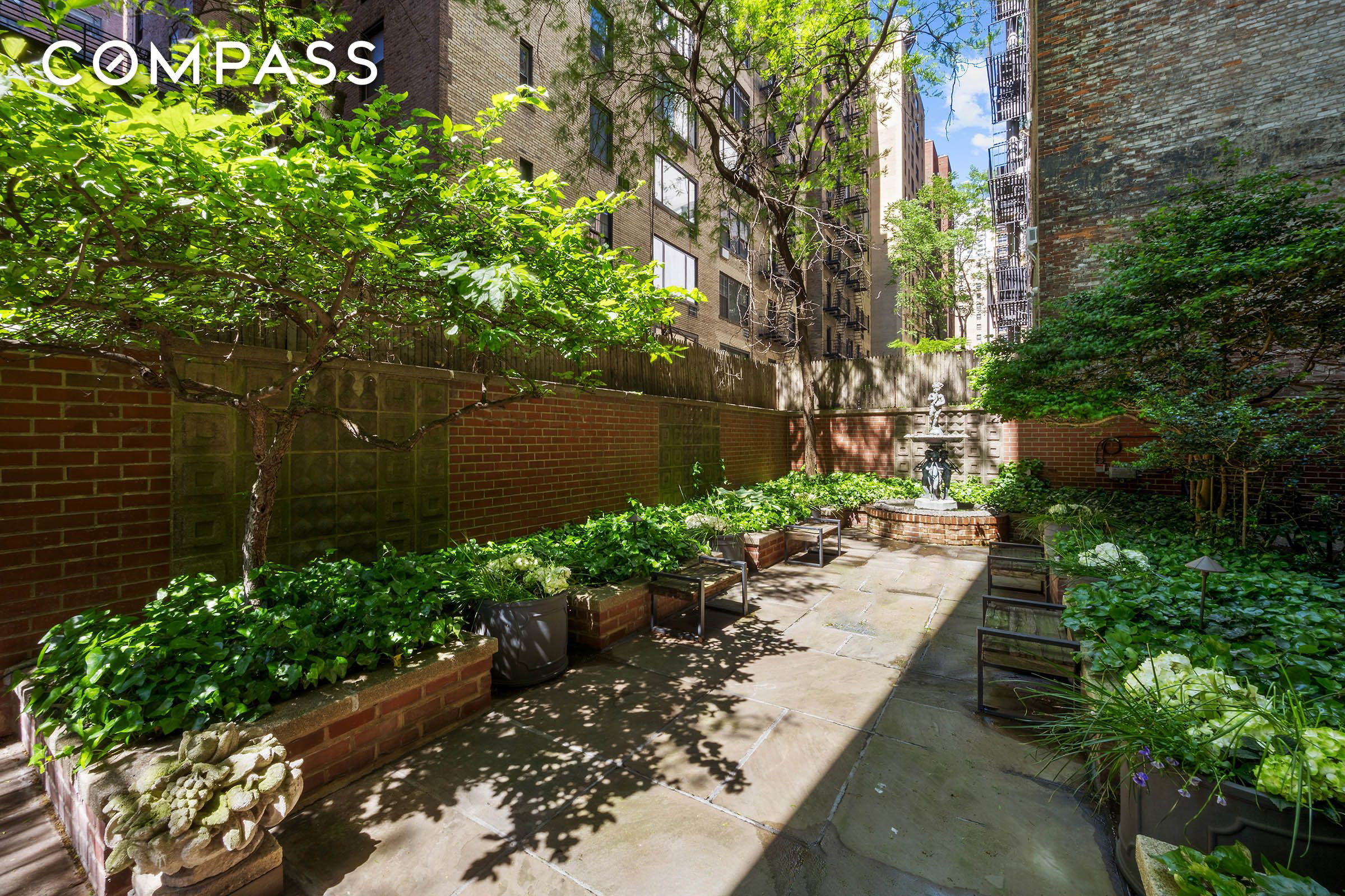 16 Sutton Place, Unit 2B Manhattan, NY 10022 - Photo 18 of 20 a view of a garden with flowers