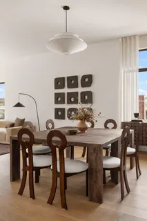 a view of a dining room with furniture and chandelier