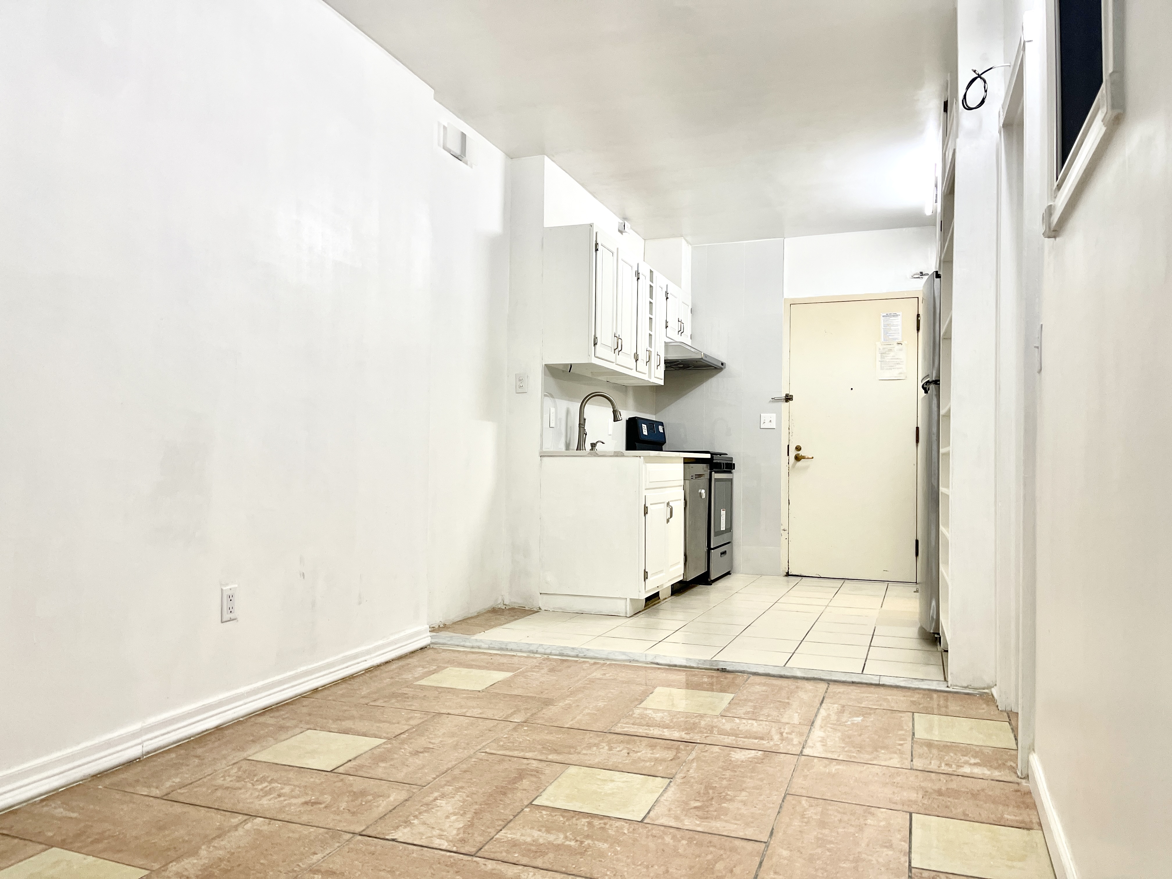 148A Madison Street, Unit 4 Manhattan, NY 10002 - Photo 4 of 13 a bathroom with a sink and a mirror