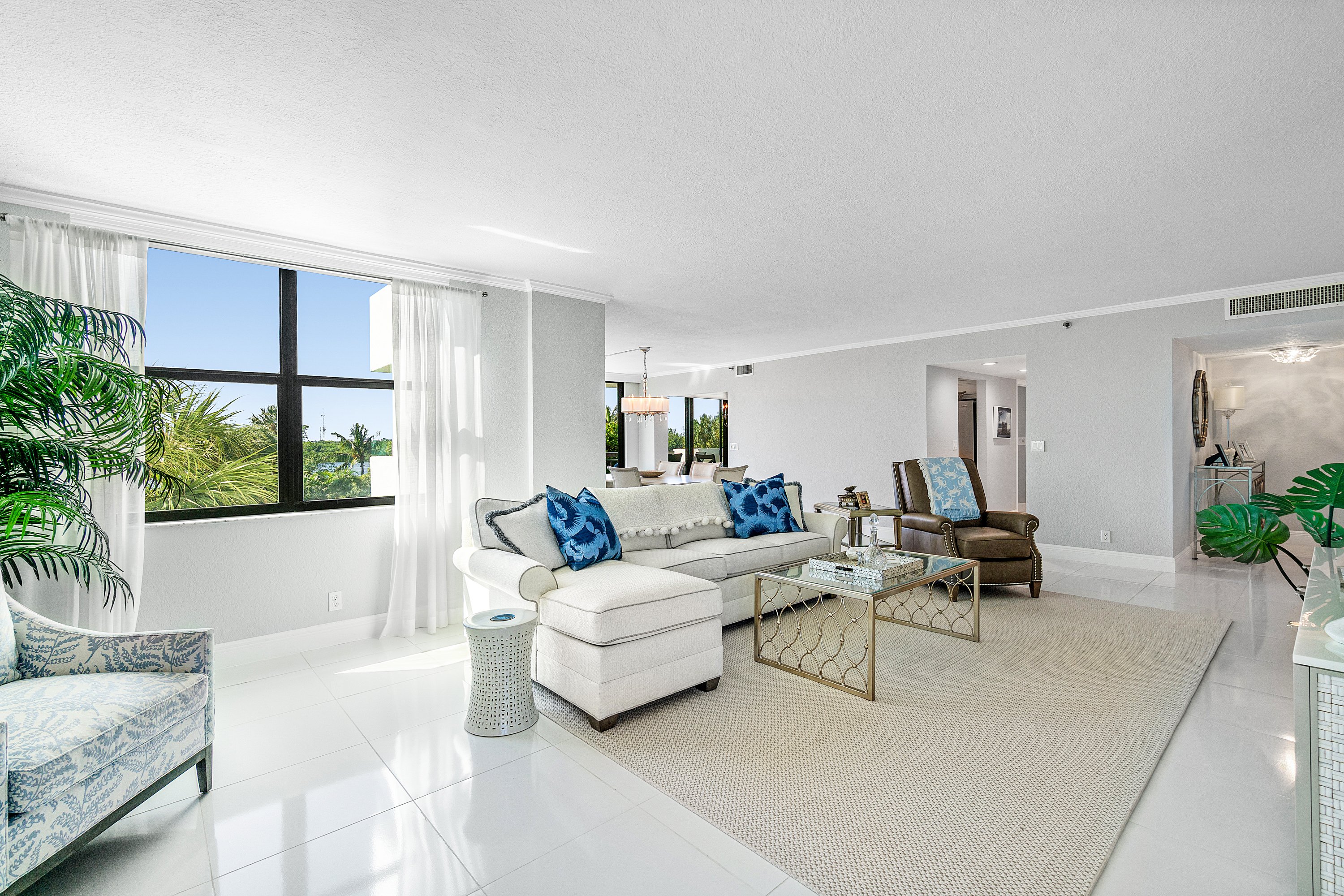 2003 North Ocean Boulevard, Unit 305 Boca Raton, FL 33431 - Photo 13 of 56 a living room with furniture and a large window
