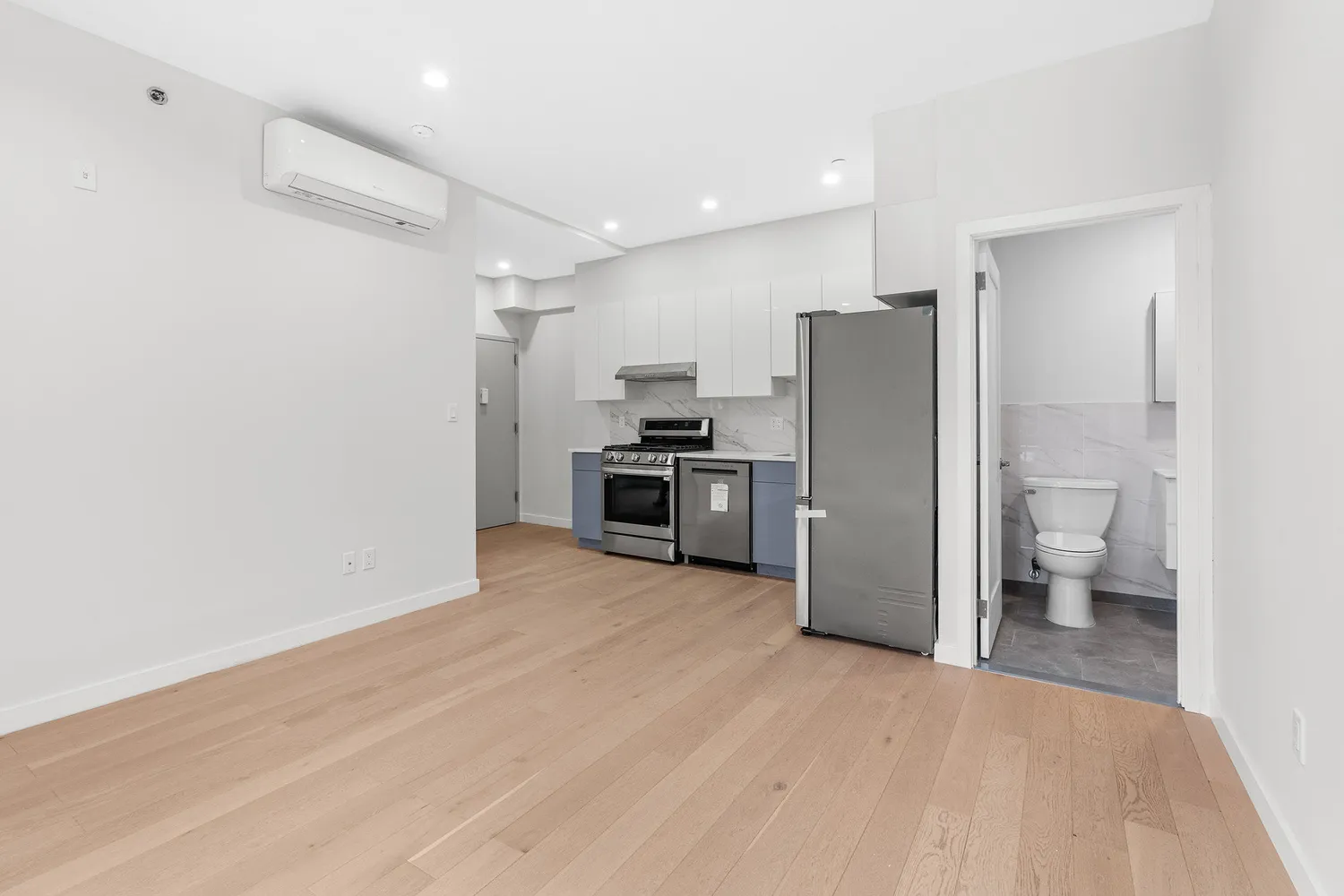 a kitchen with a refrigerator and a sink