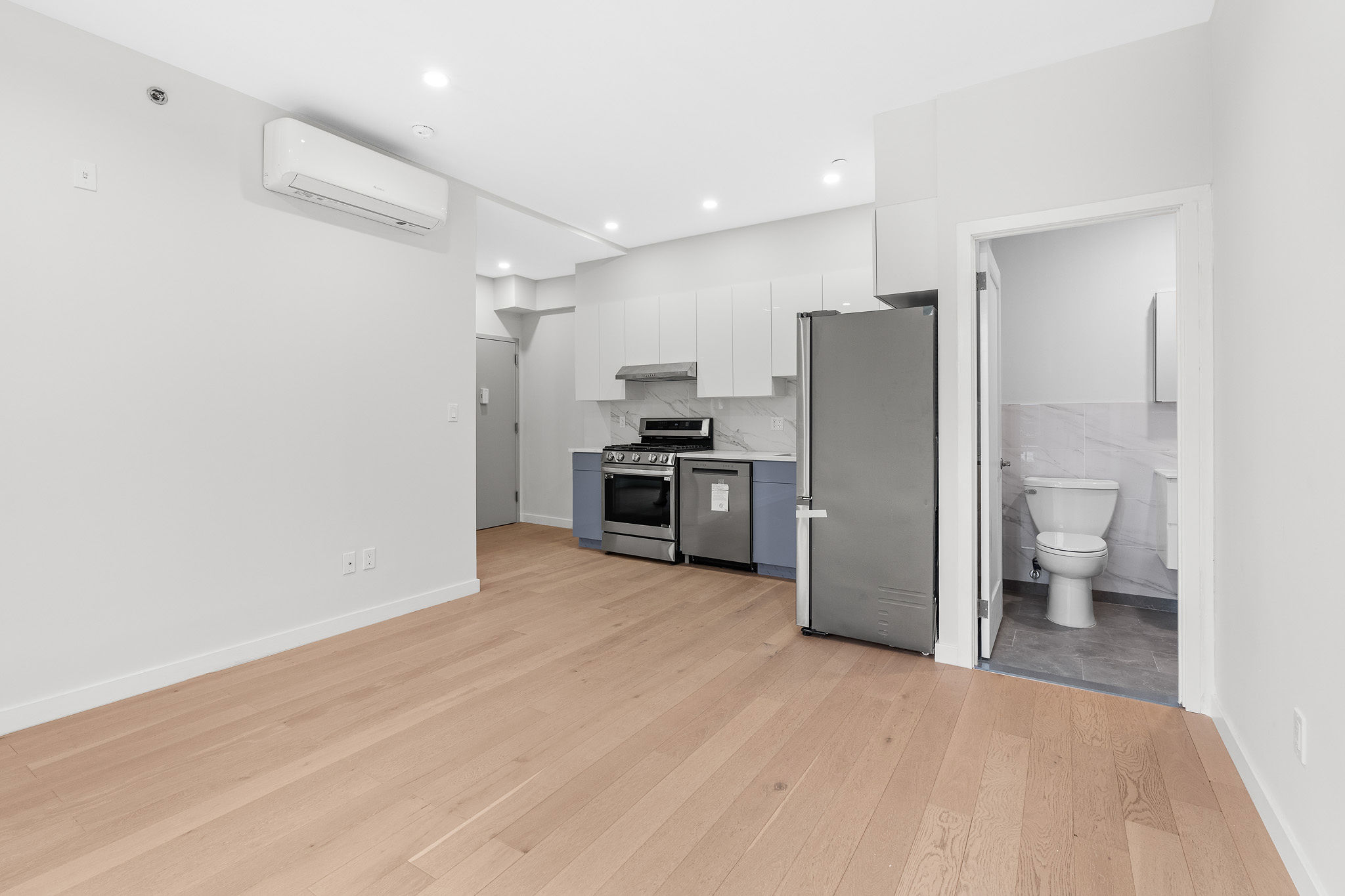 a kitchen with a refrigerator and a sink