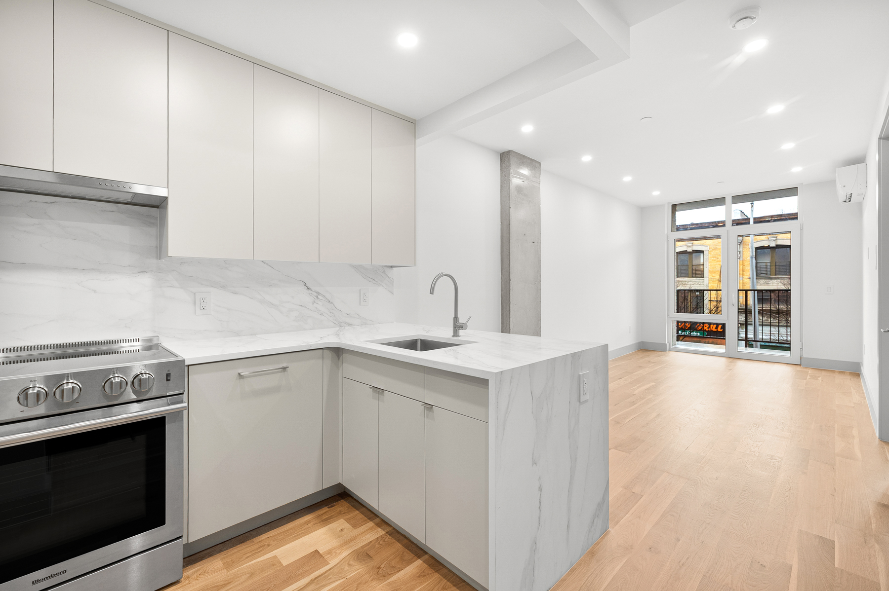 a kitchen with a sink stove and cabinets