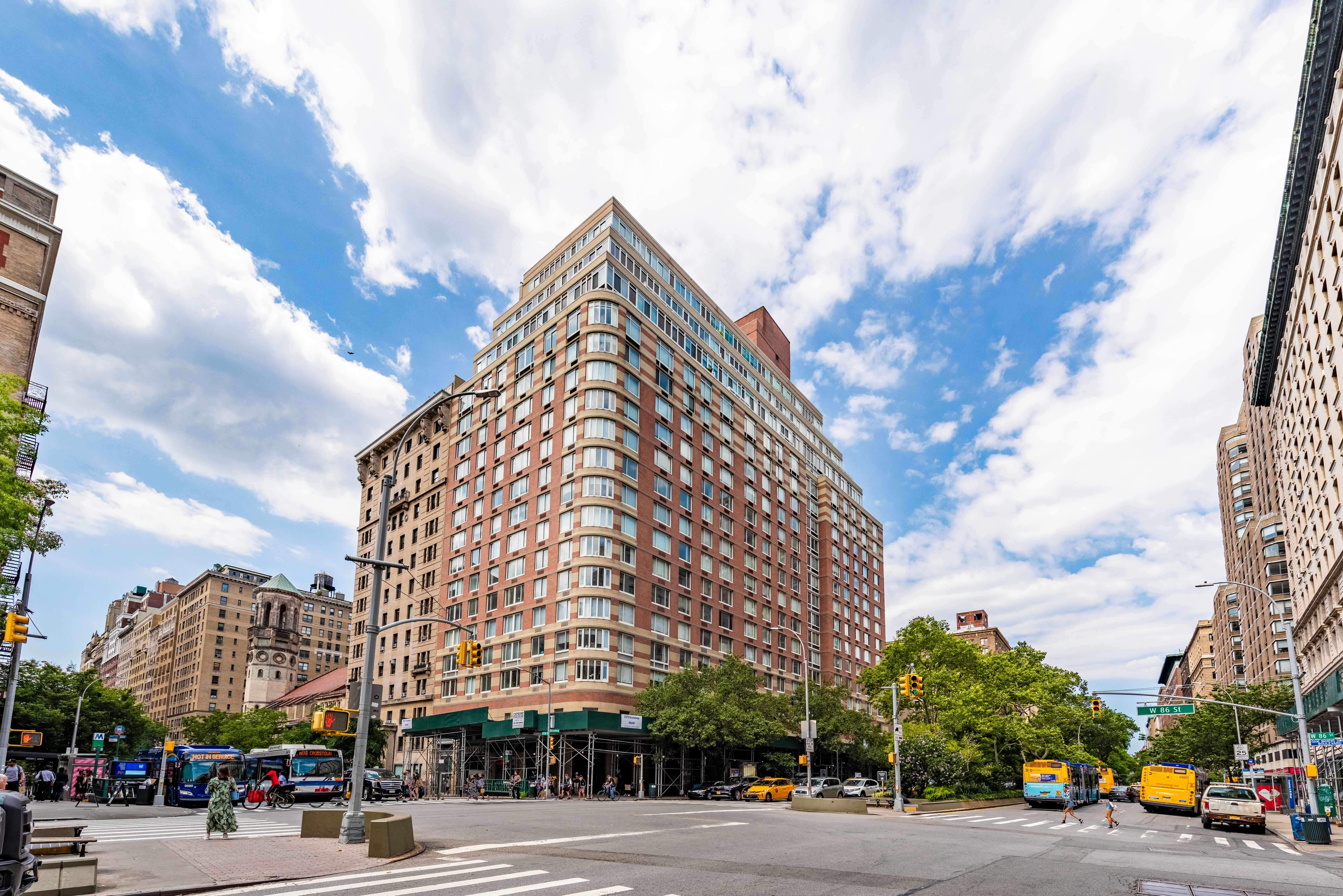 2373 Broadway, Unit 630 Manhattan, NY 10024 - Photo 16 of 17 a view of a city street lined with buildings and trees