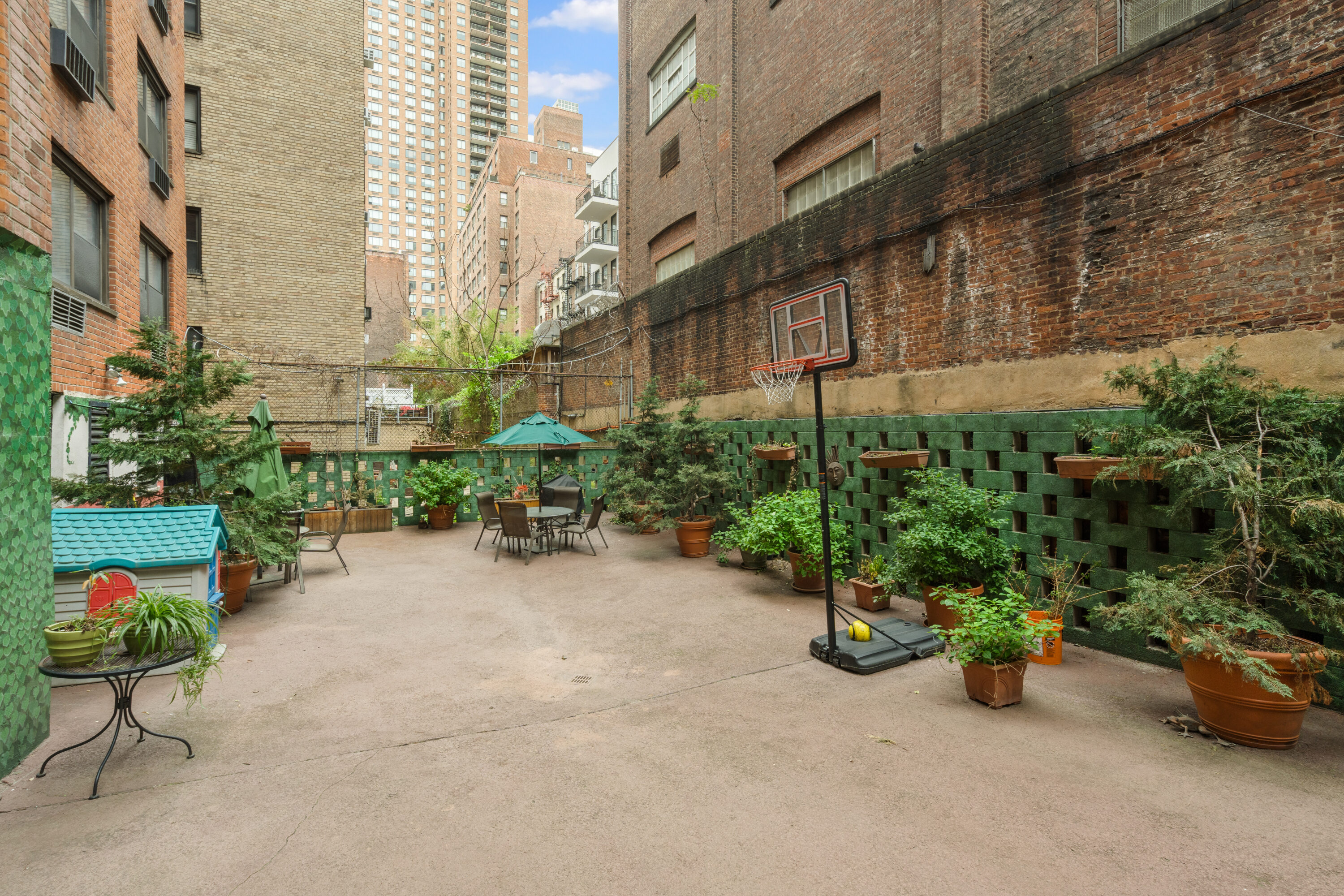 347 East 53rd Street, Unit 2C Manhattan, NY 10022 - Photo 14 of 18 a view of a street with potted plants