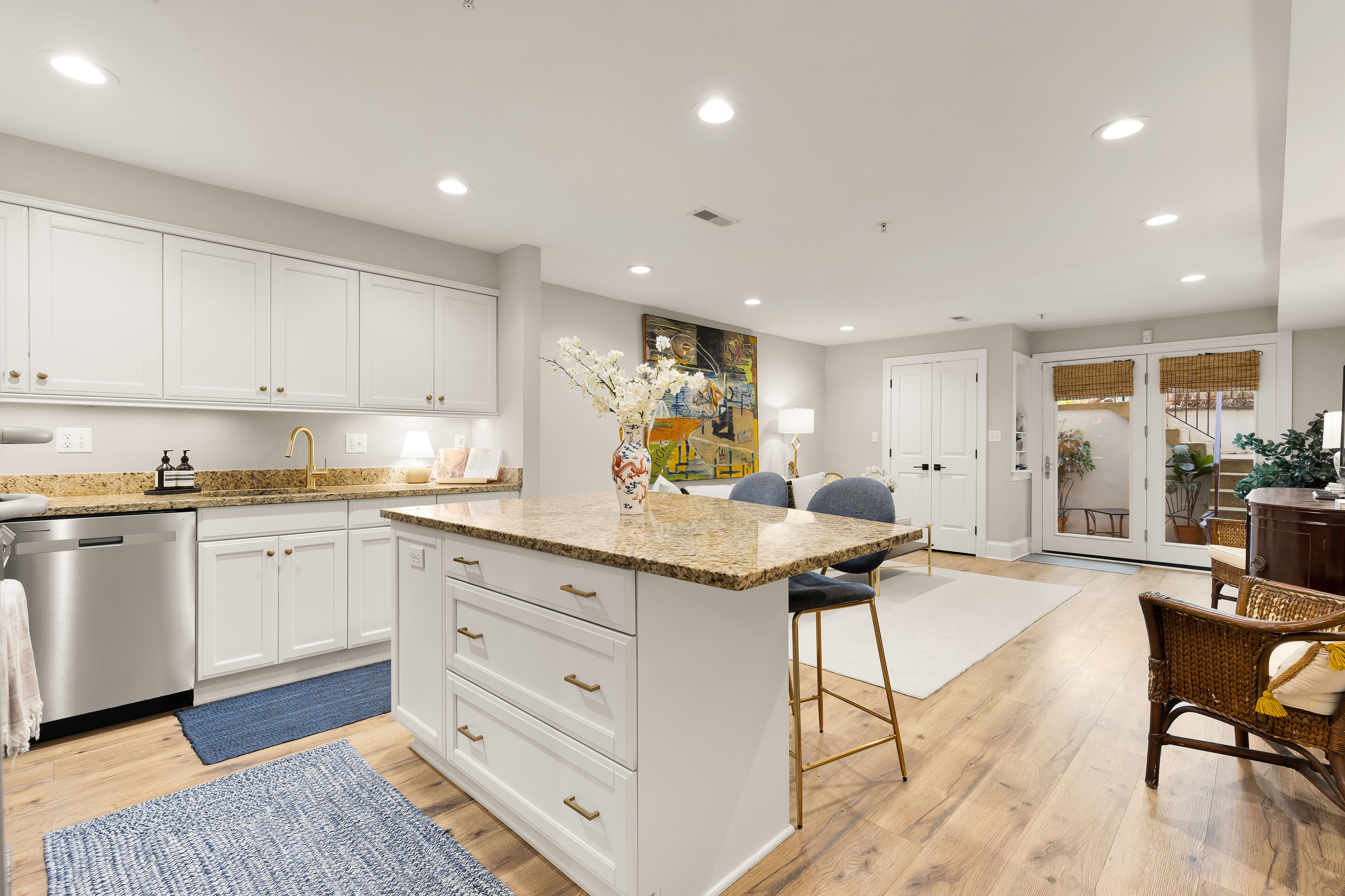 1354 Kenyon Street Northwest, Unit G Washington, DC 20010 - Photo 19 of 35 a kitchen with granite countertop a sink and cabinets