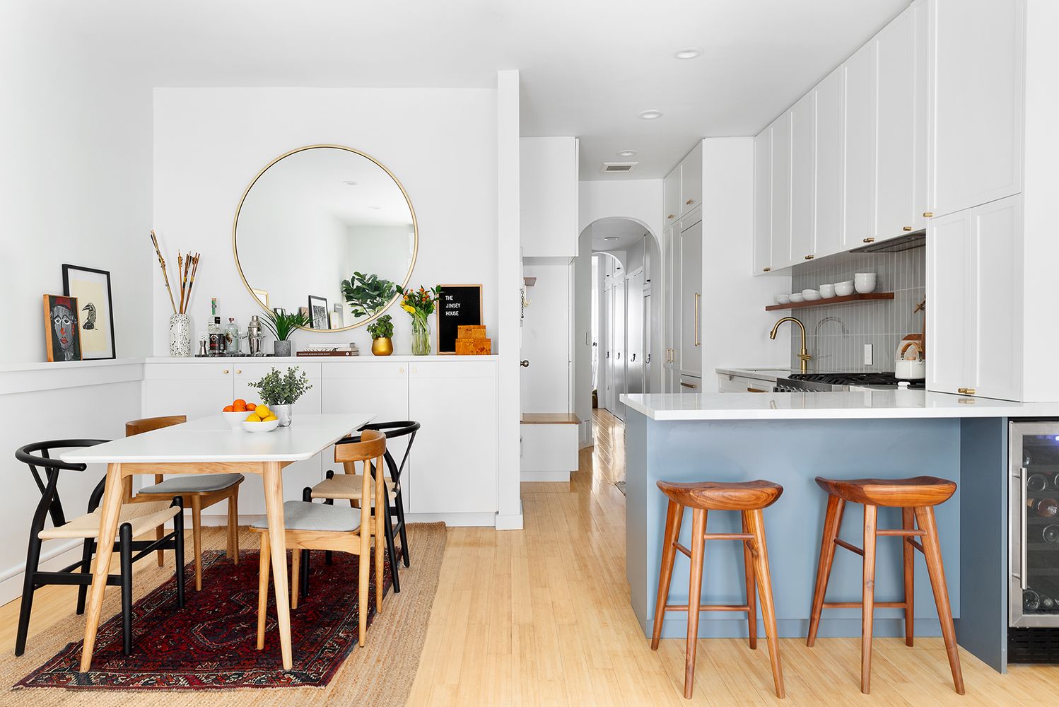 a view of dining room kitchen with stainless steel appliances granite countertop and chairs