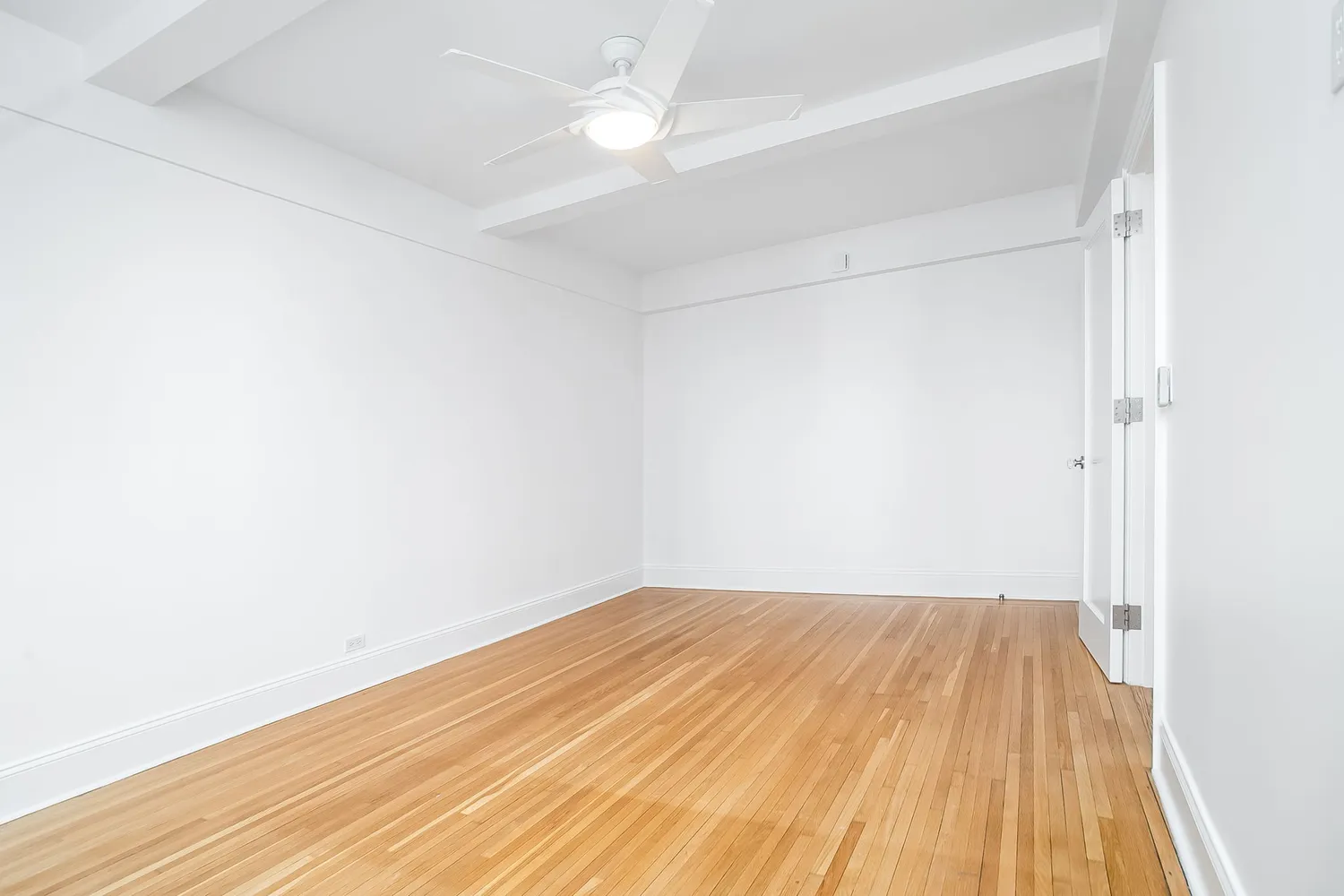 a view of small space with wooden floor