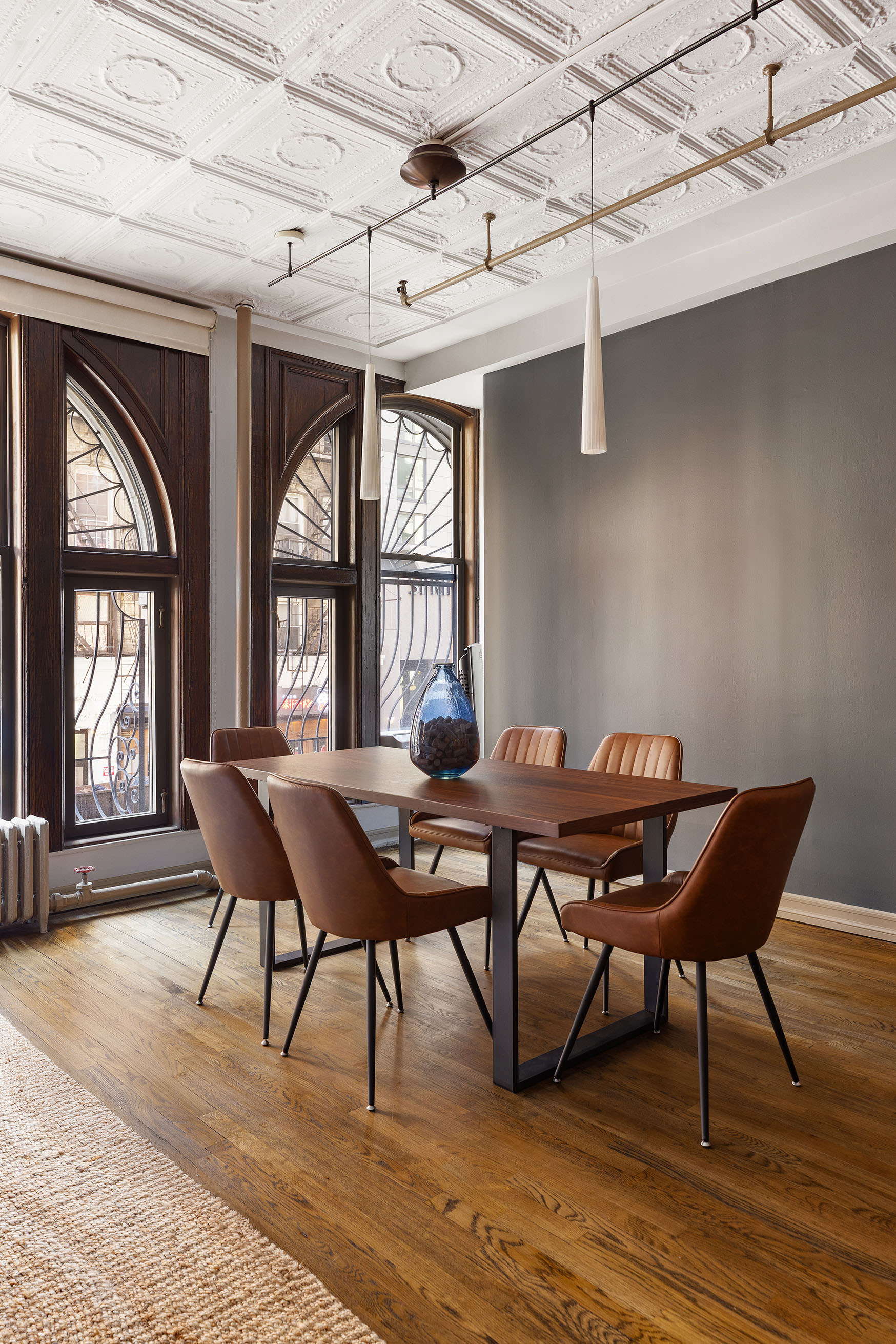 133-131 West 28th Street, Unit 2A Manhattan, NY 10001 - Photo 3 of 7 a view of a dining room with furniture wooden floor and a window